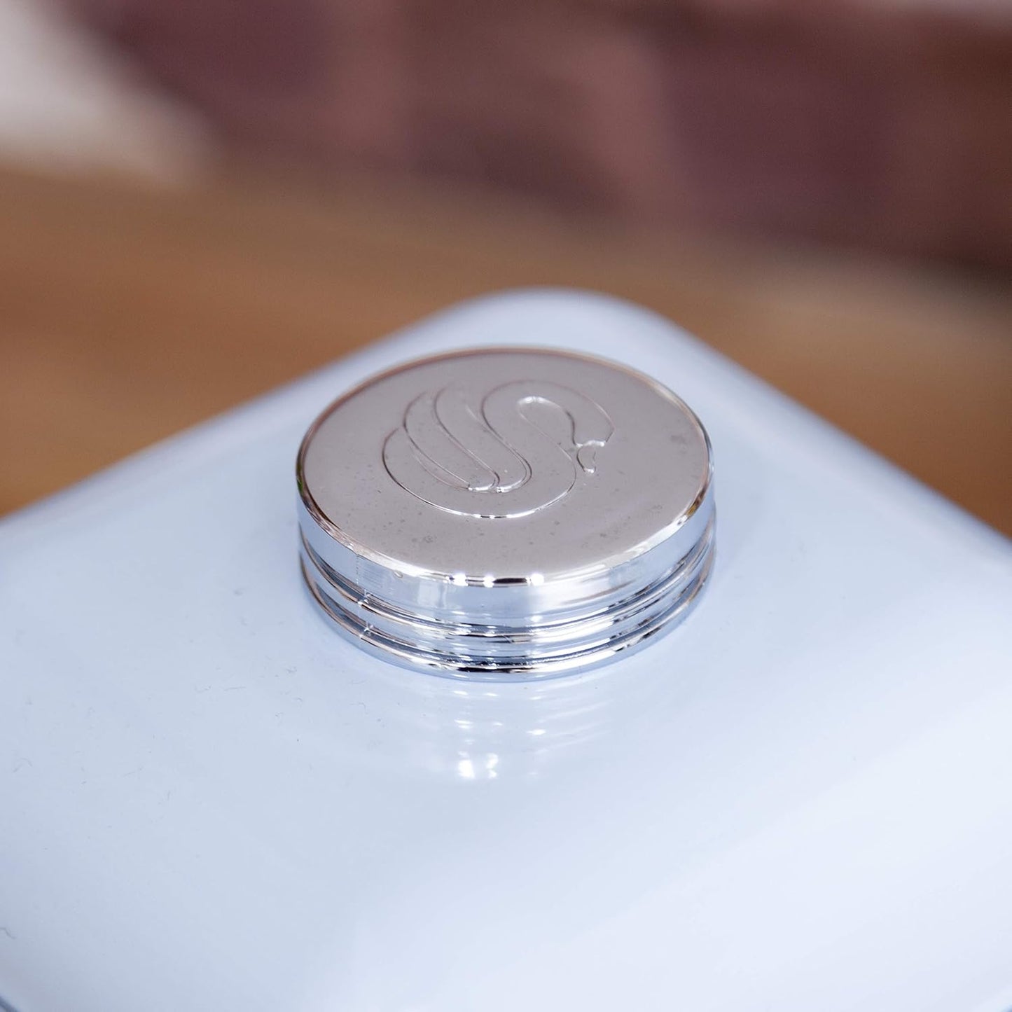 Blue bread bin lid with embossed Swan logo on round metal knob