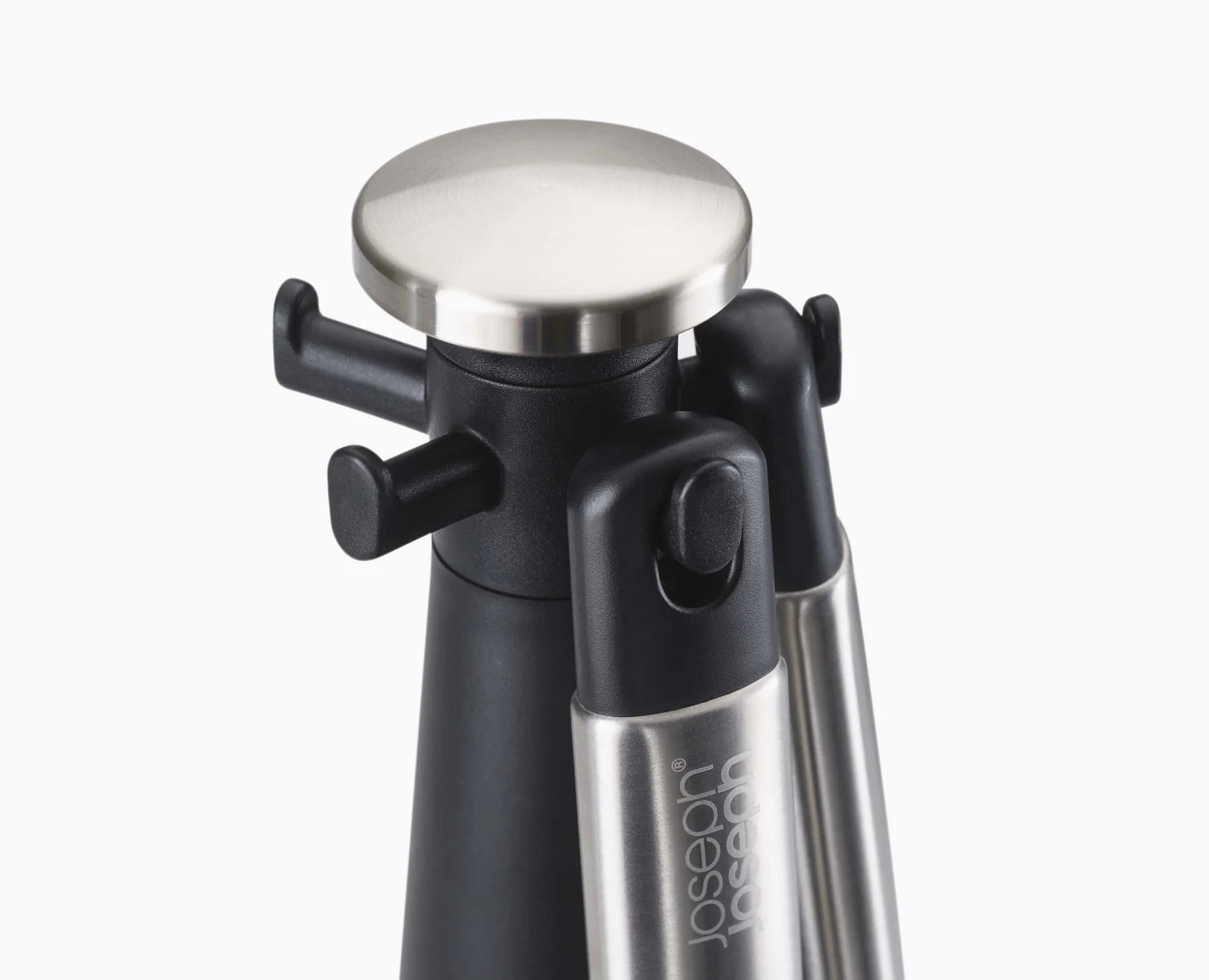 Black-and-stainless utensil carousel stand with silicone tool compartments