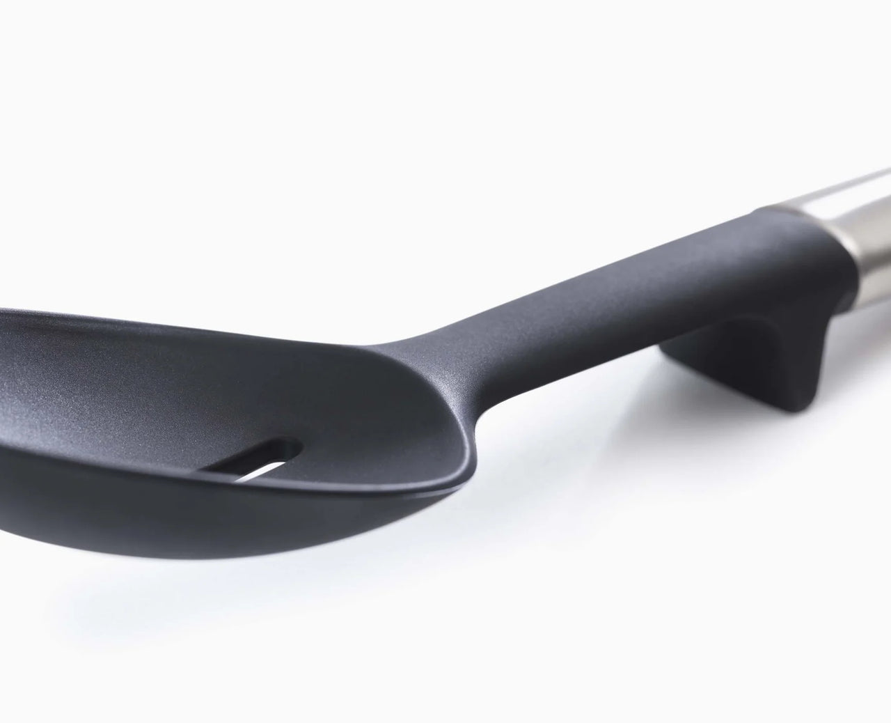 Black silicone spoon head with stainless handle and angled rim