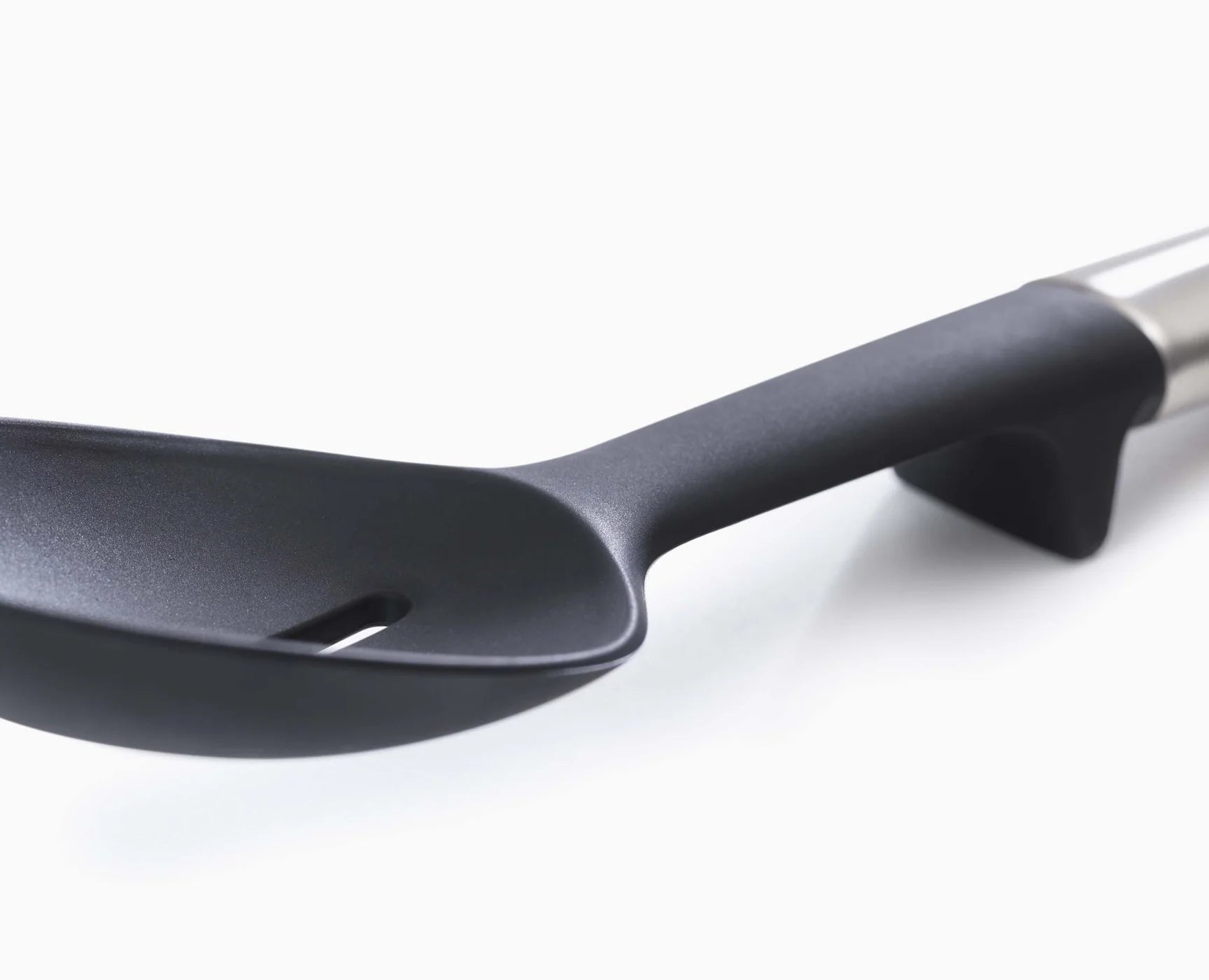 Black silicone spoon head with stainless handle and angled rim