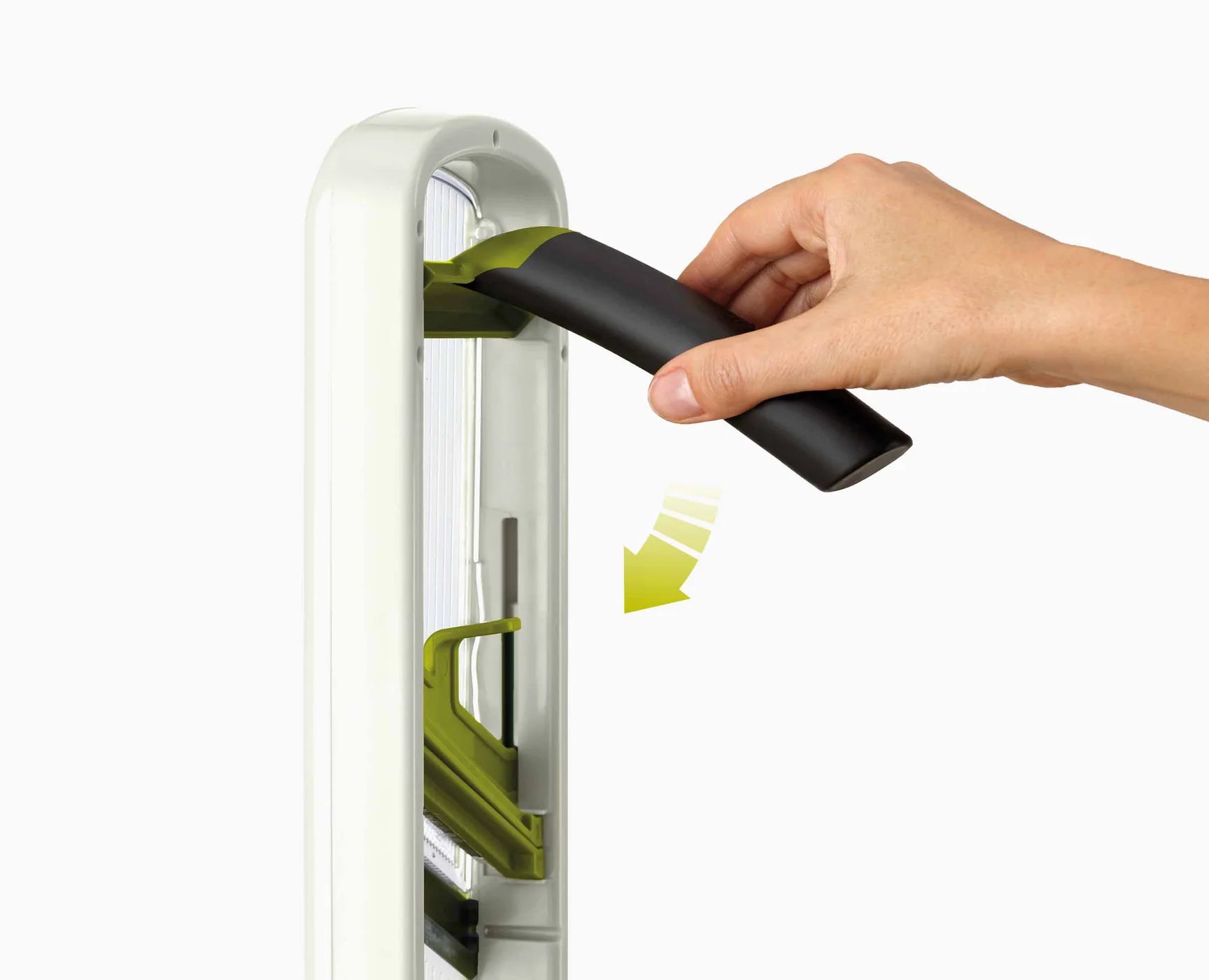 White mandoline with black push handle and green food-grip insert
