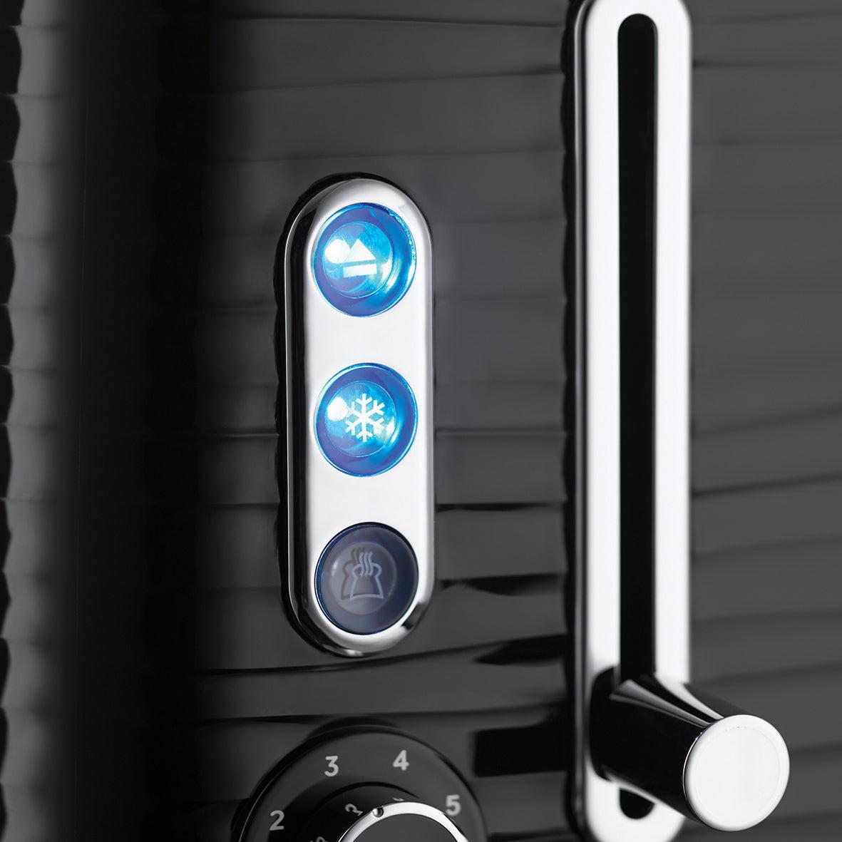 Close-up of black toaster control panel with blue LED buttons and browning dial