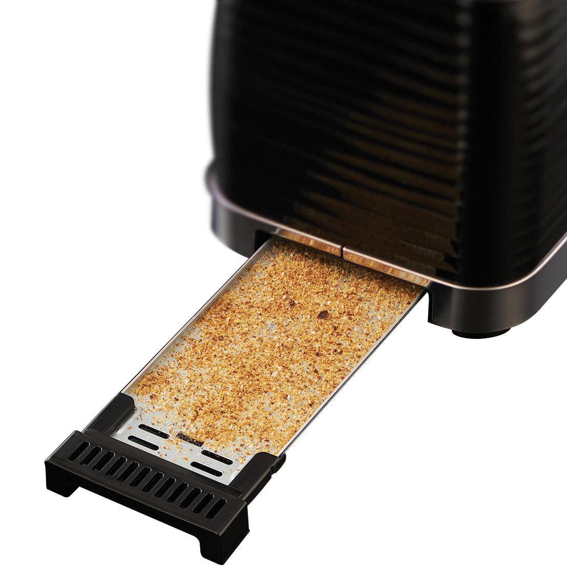Black 2-slice toaster crumb tray pulled out with toasted crumbs