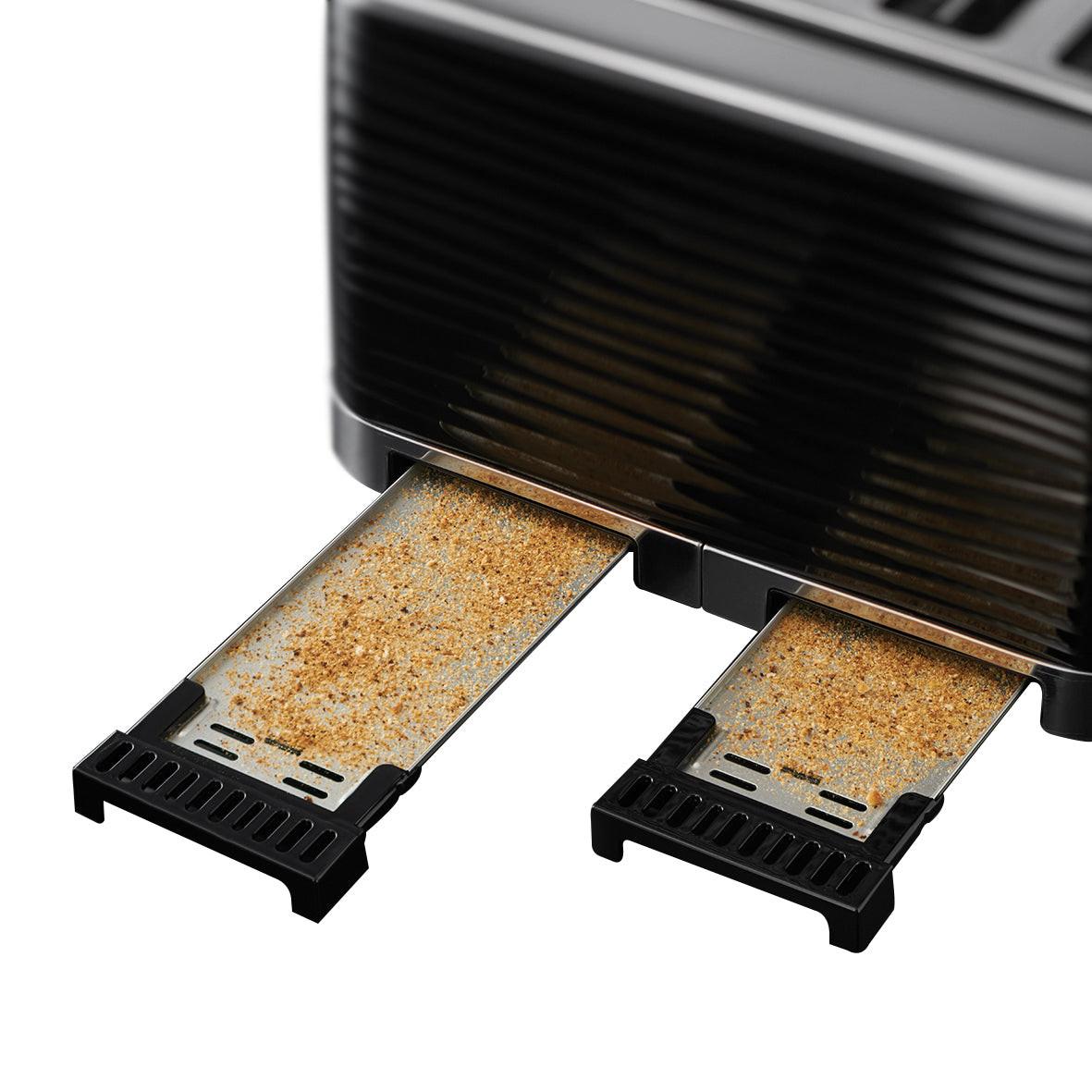 Black 4-slice toaster interior showing two bread slots with crumb trays