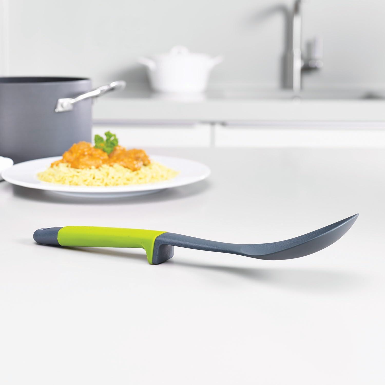 Kitchen slotted spoon with yellow-green handle and dark gray silicone head, utensil set piece