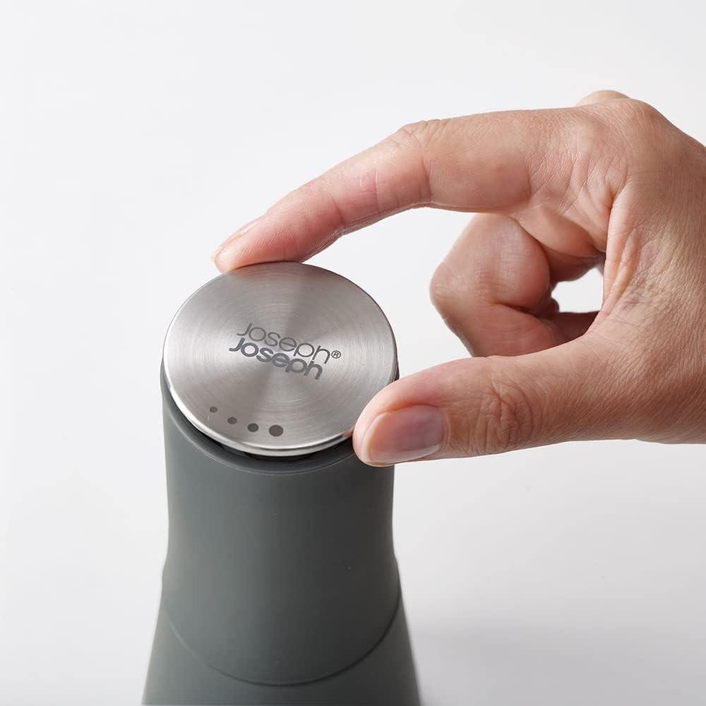 Dark grey non-spill salt and pepper mill with stainless top, hand lifting lid