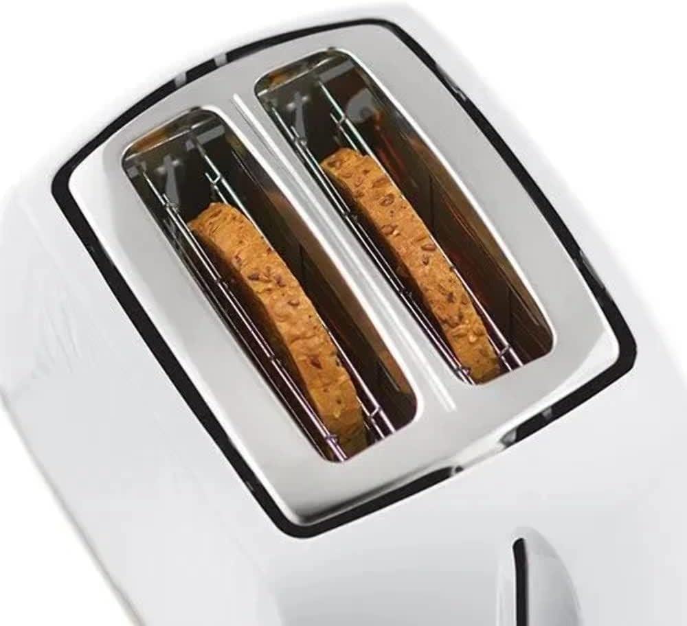 White toaster with two bread slices inside the slots and heating elements