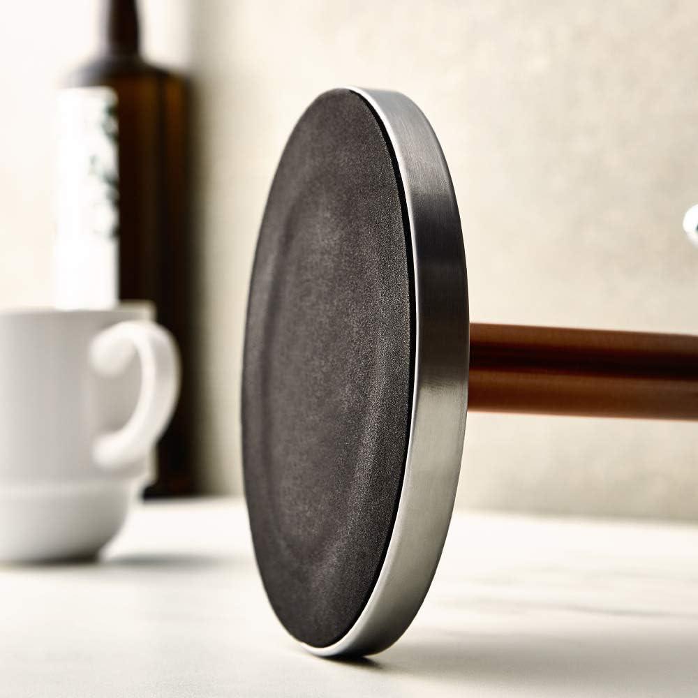 Round dark underside pad on stainless copper post of mug and towel stand