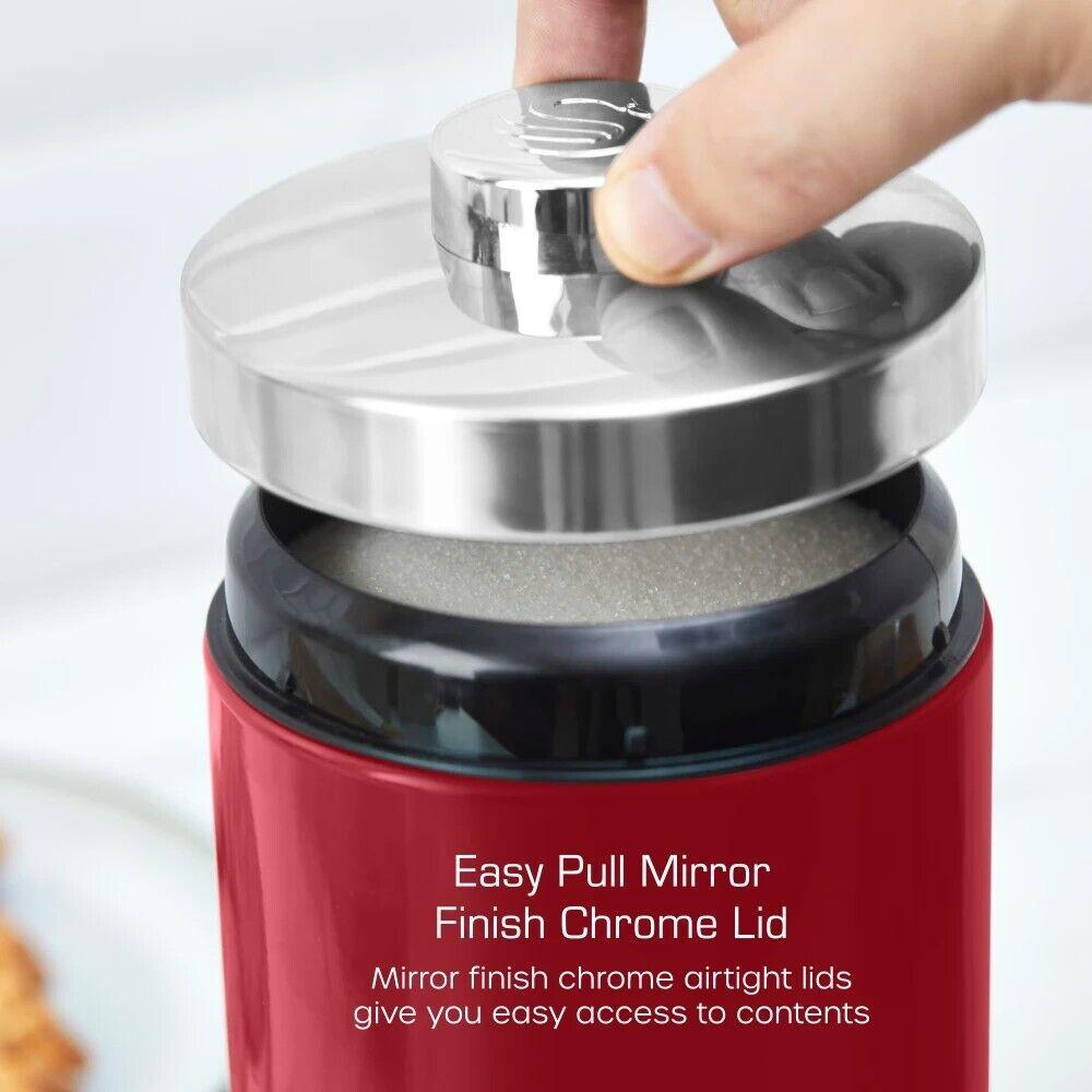 Red metal kitchen canister with mirrored chrome lid and easy-grip pull top