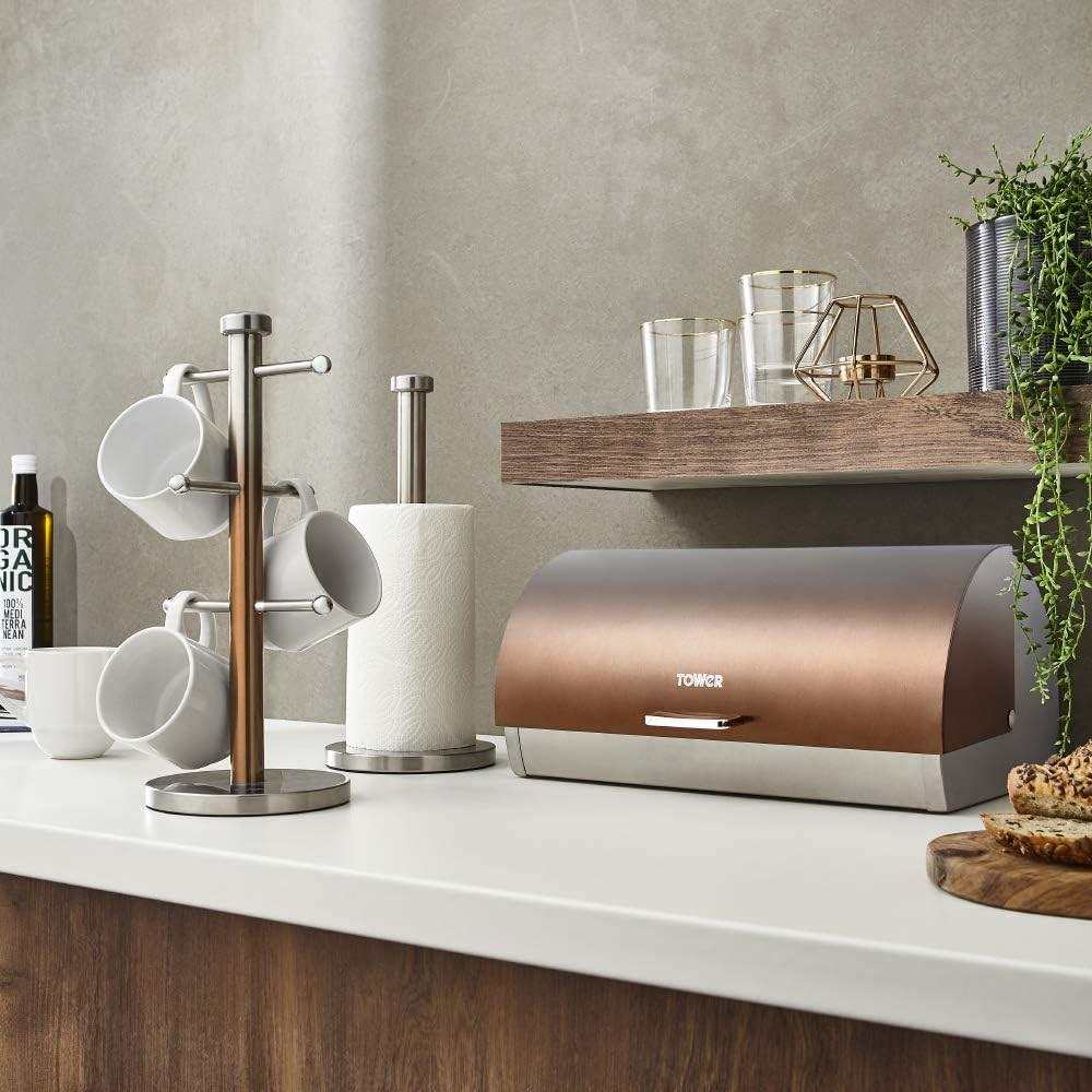 Kitchen counter set with copper towel pole, white mugs on hooks, and paper towel roll
