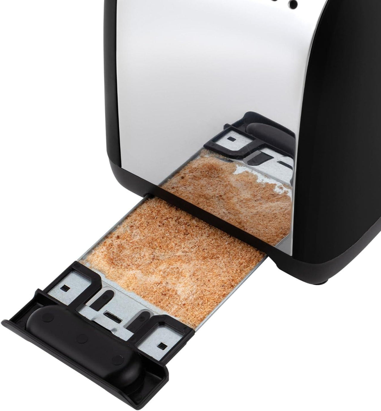 Open toaster slots showing two toasting chambers with crumb tray removed