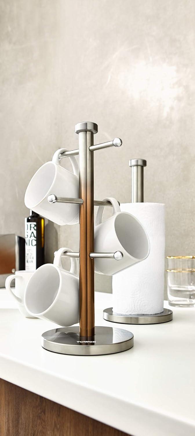 Copper towel pole with several white mug hooks and a paper towel roll on round base