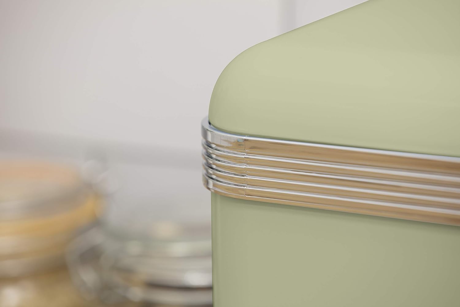 Green bread bin lid edge with silver ridged trim and clear knob