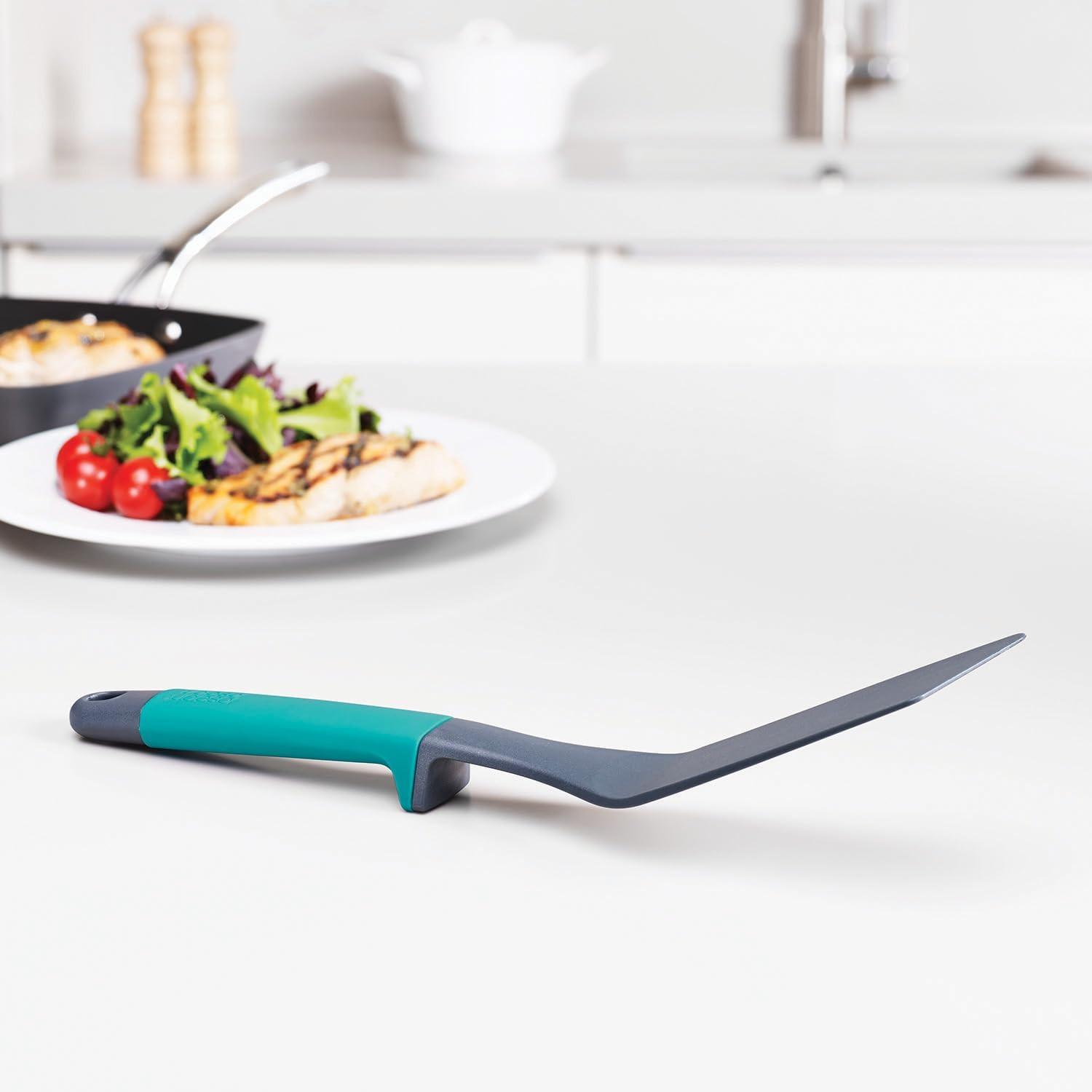 Kitchen slotted spatula with teal handle and dark gray head, utensil set piece