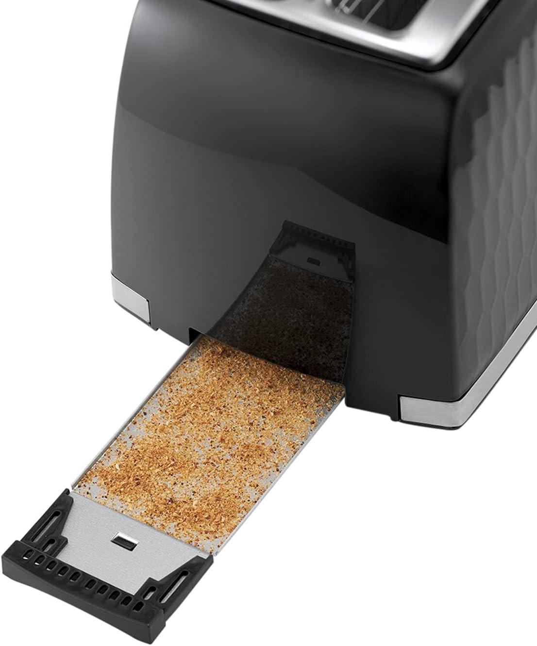 Black 2-slice toaster with open crumb tray showing toast crumbs