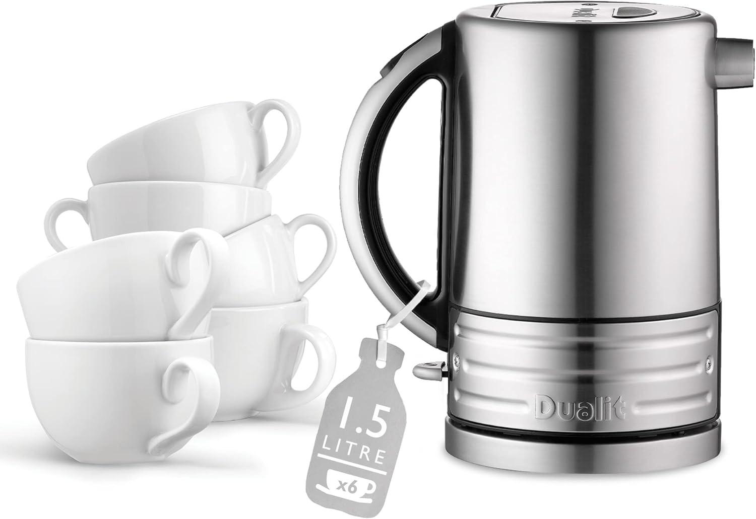Stainless steel jug kettle with black handle and white cups beside it