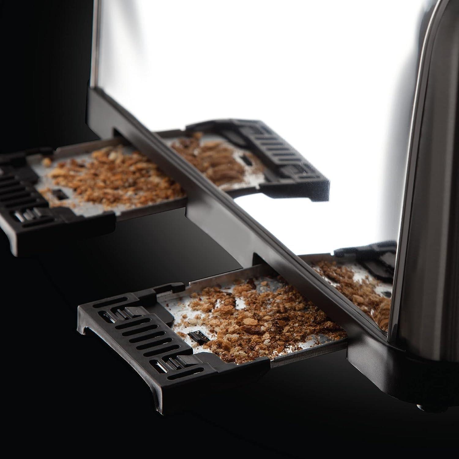 Silver toaster with open slots and toasted bread pieces inside