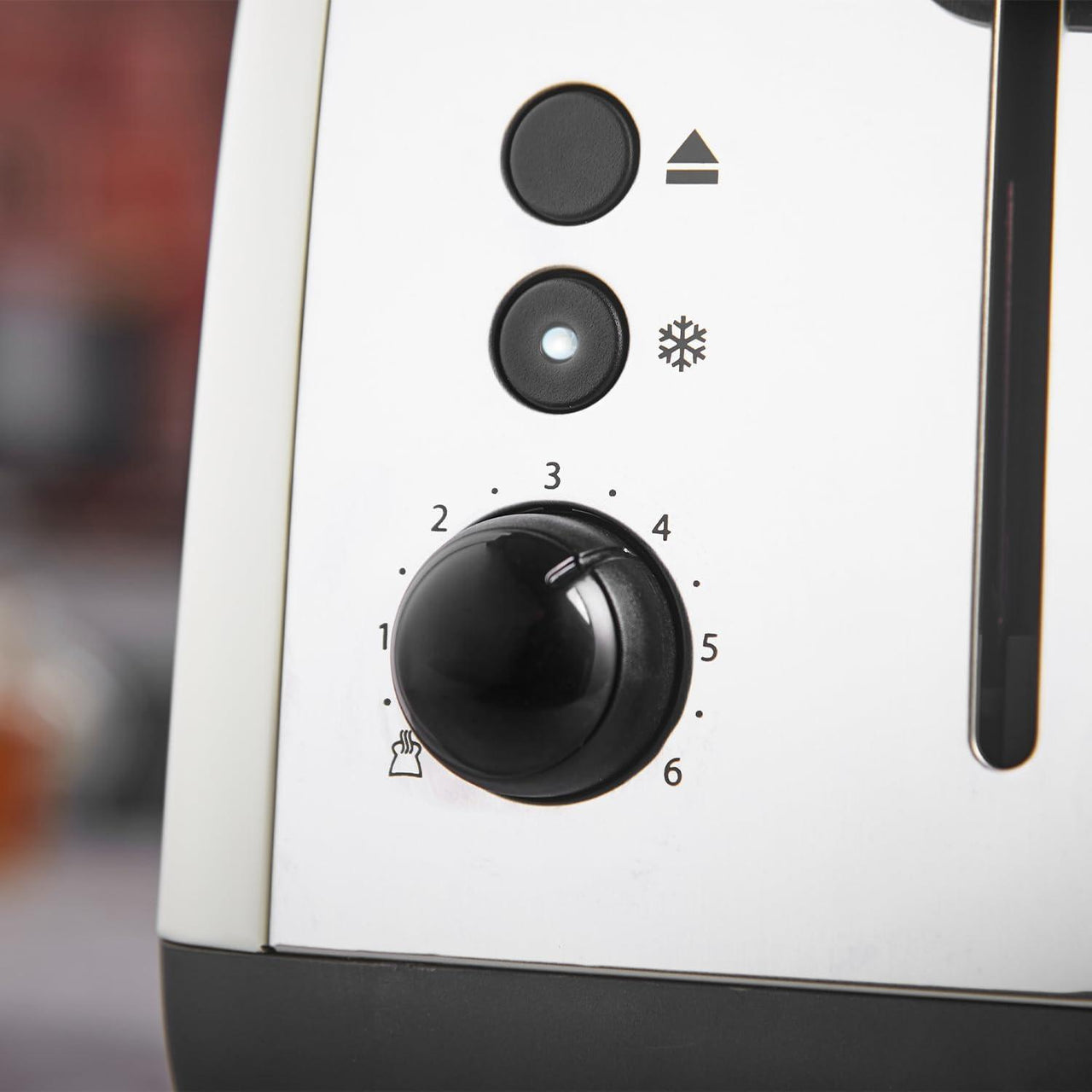 Jasmine cream toaster control panel with browning dial and function buttons.