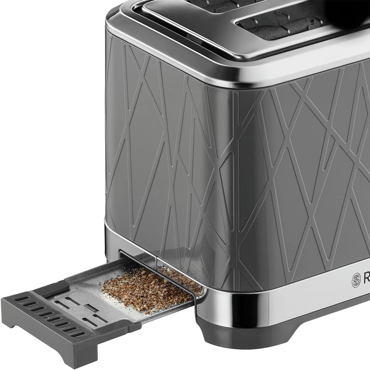Grey 2-slice toaster with open crumb tray and vented underside