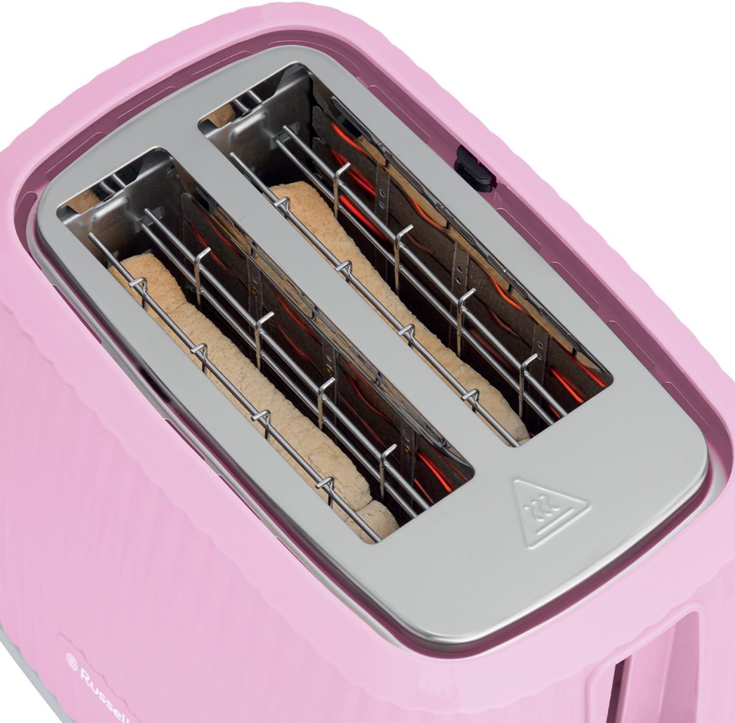 Pink toaster with open top and visible heating elements inside the slots.