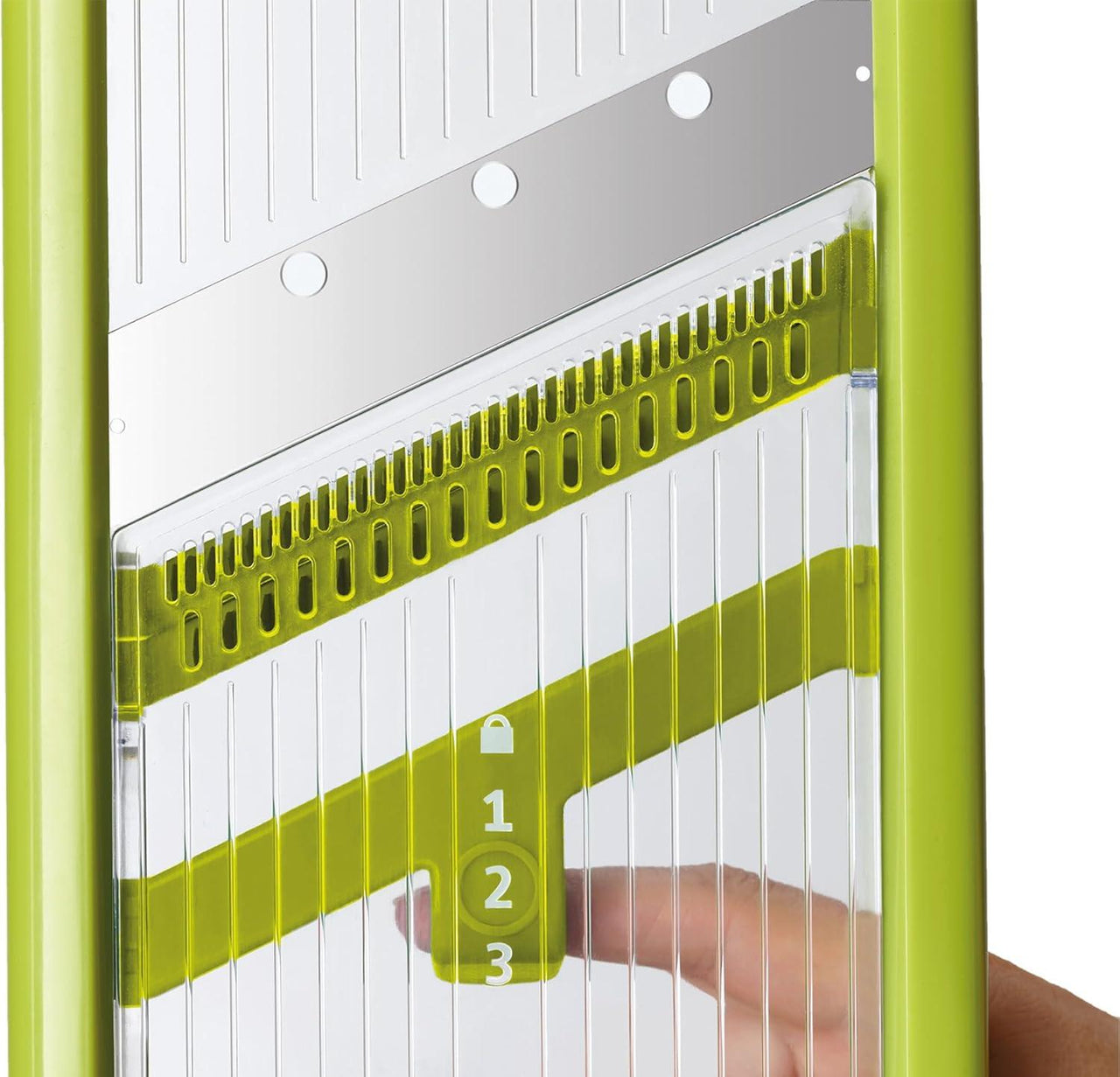 Close-up of green mandoline cutting guide with numbered thickness settings