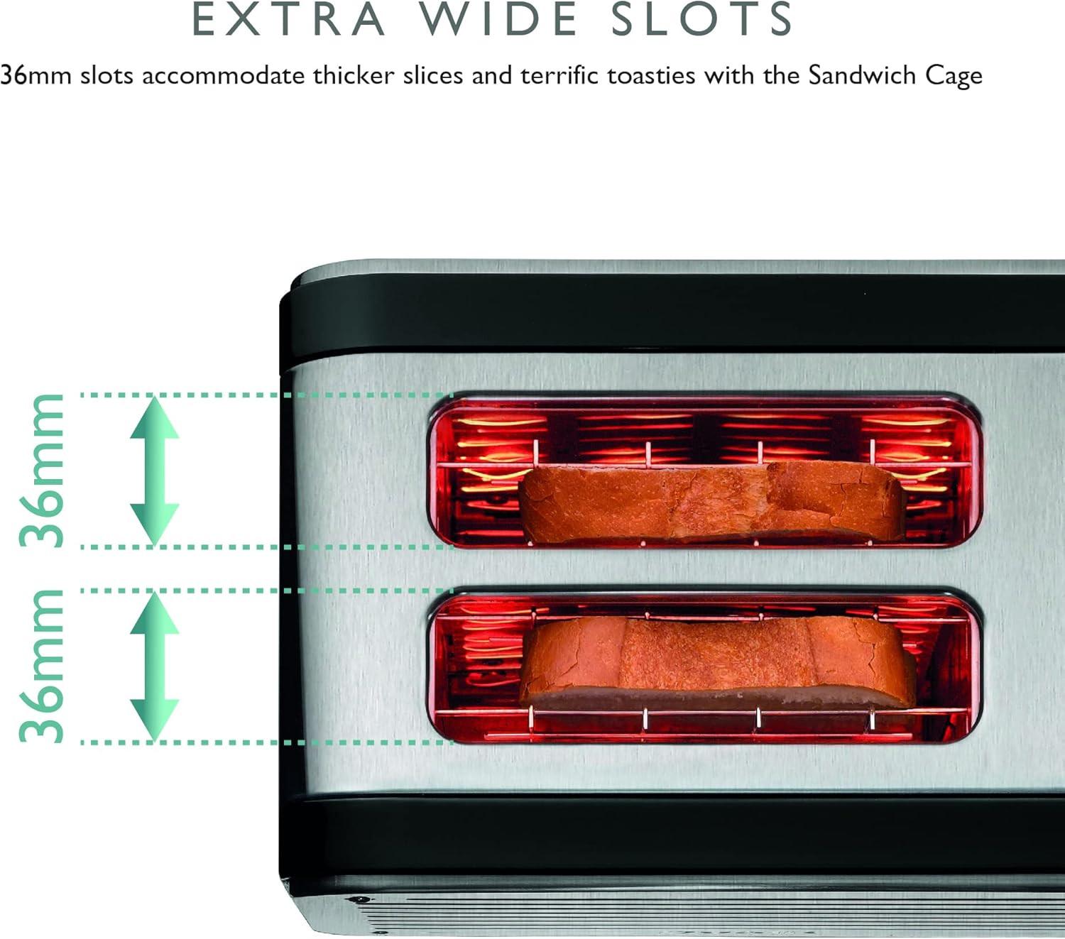 Close-up of black toaster showing two wide slots with toasted bread inside.