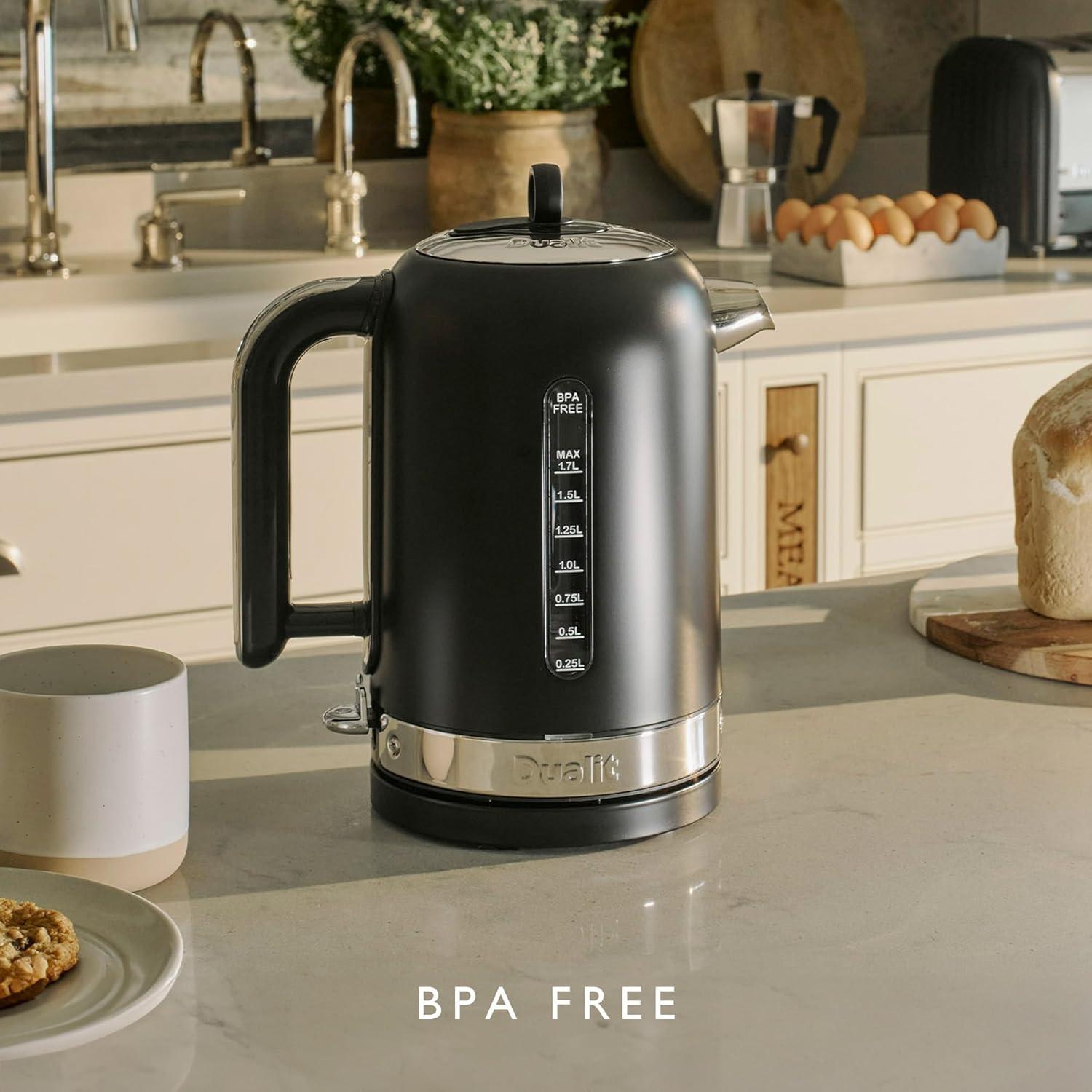 Matte black electric kettle on countertop with spout and water level markings visible