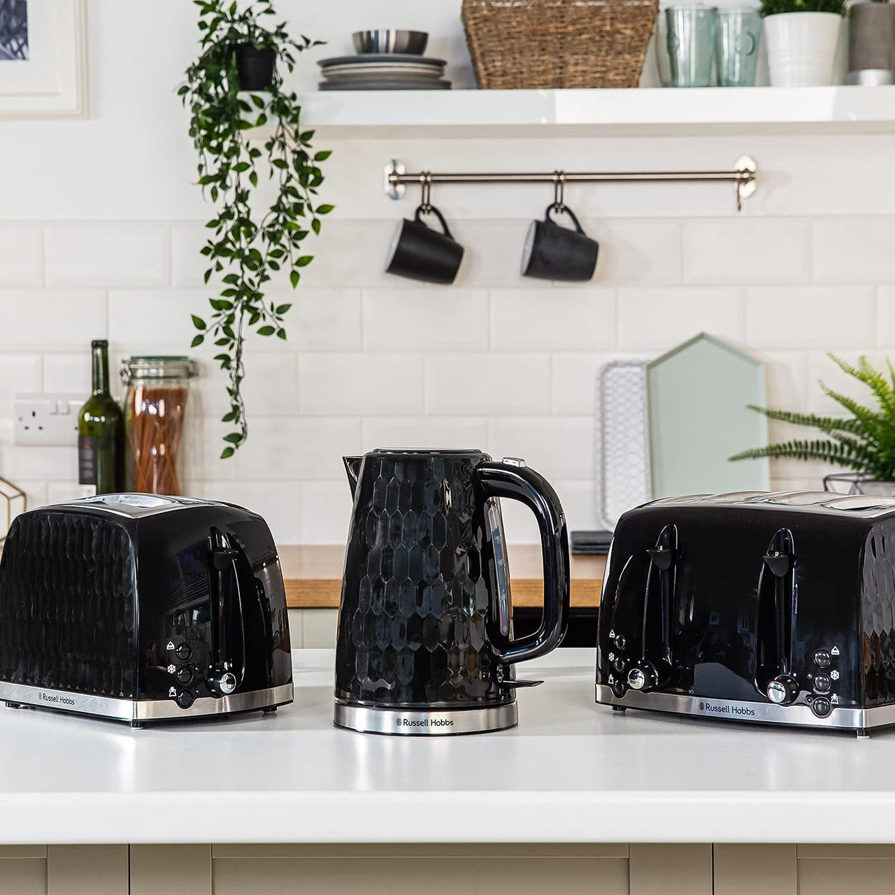 Black 2-slice toaster with chrome accents and honeycomb front