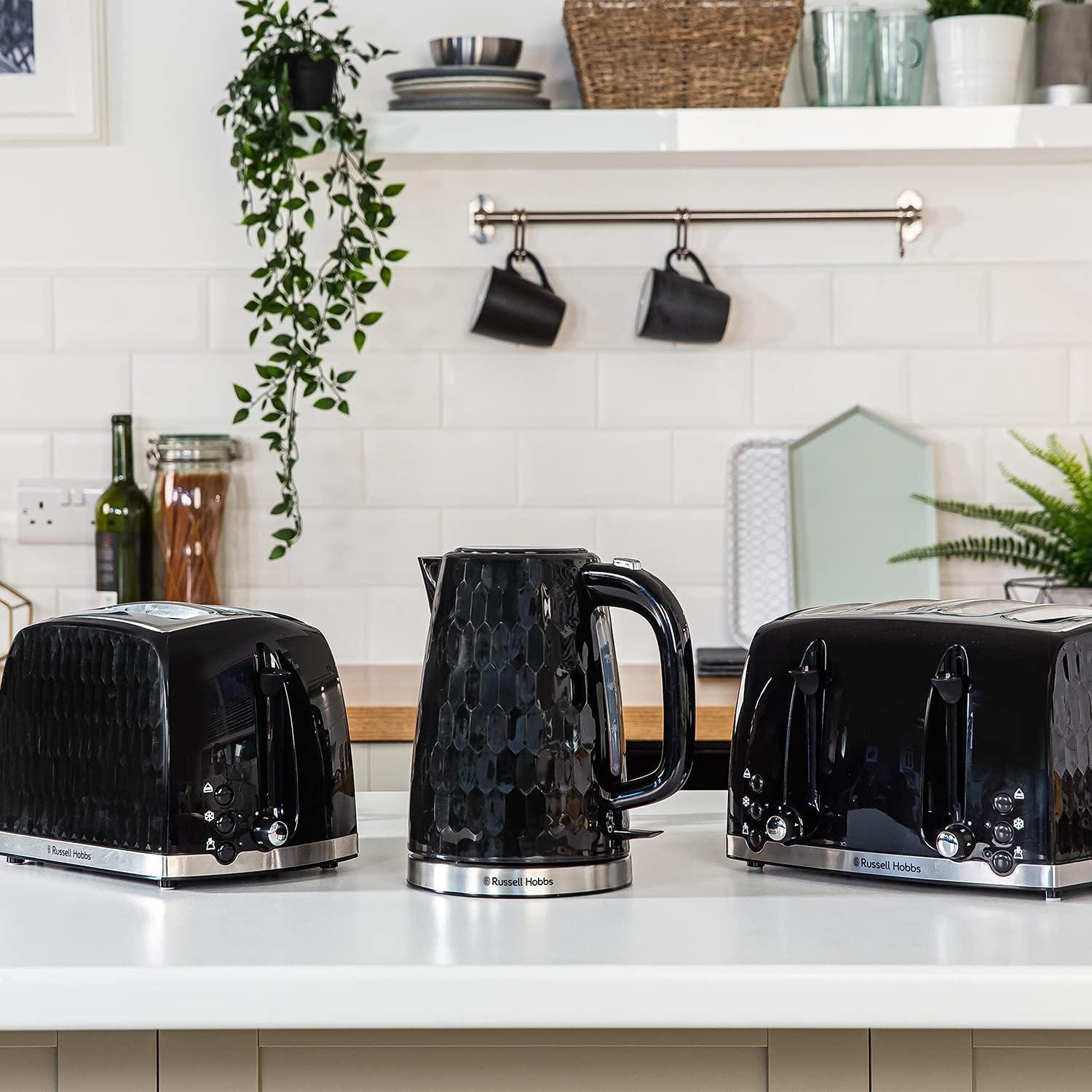 Black 2-slice toaster with chrome accents and honeycomb front