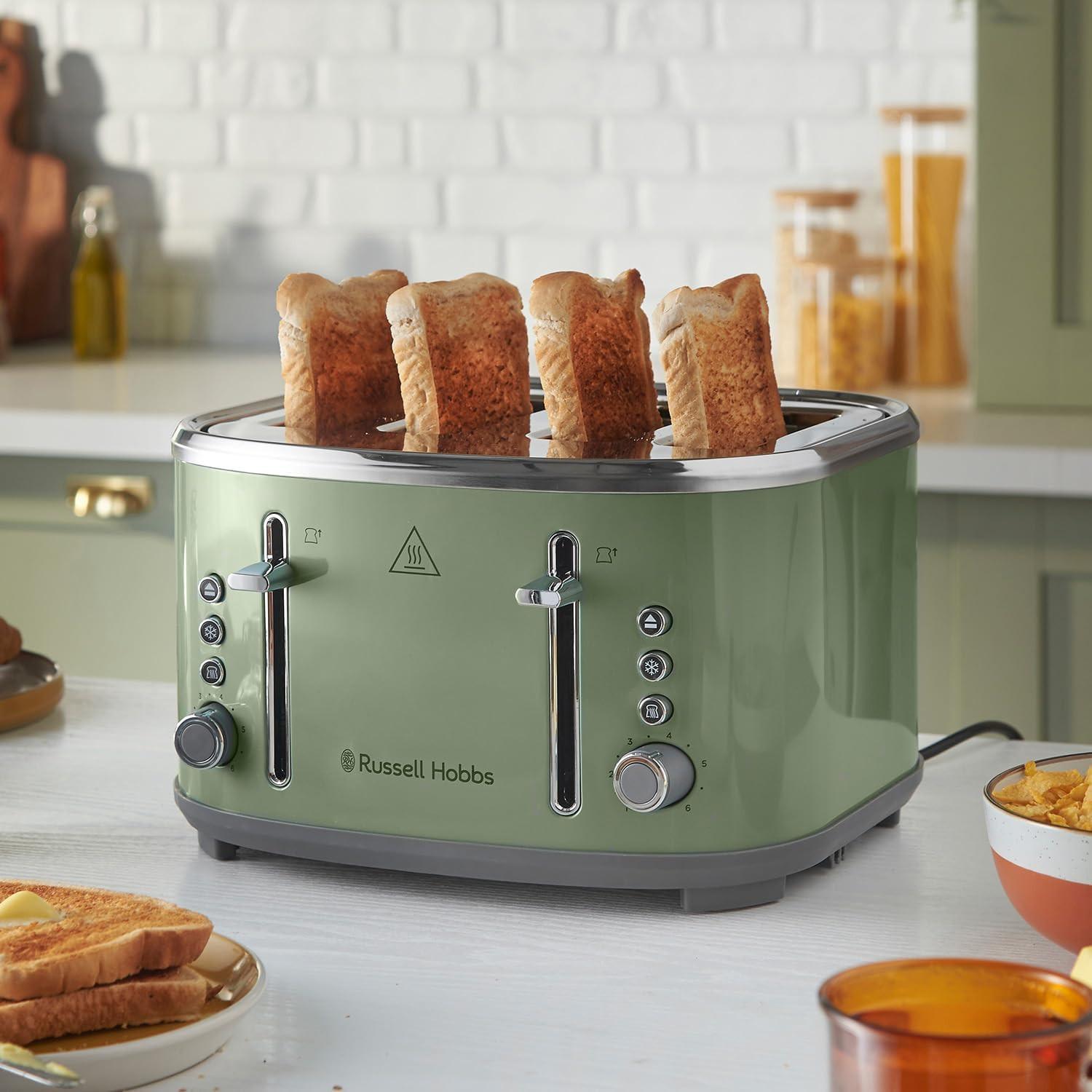 Sage 4-slice toaster with four upright toasted bread slices inside the heating slots