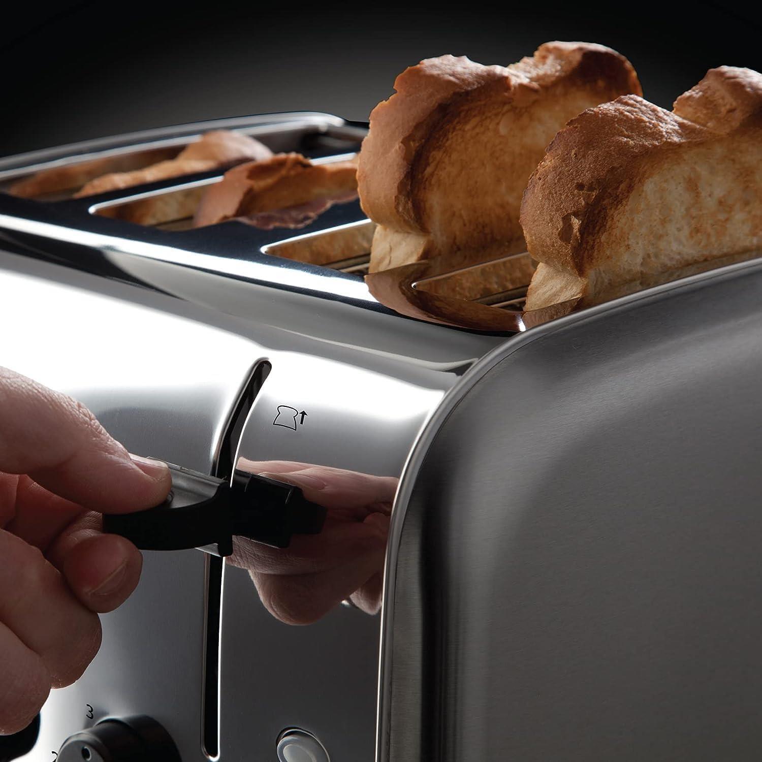 Silver 4-slice toaster with bread in slots and lever being lowered