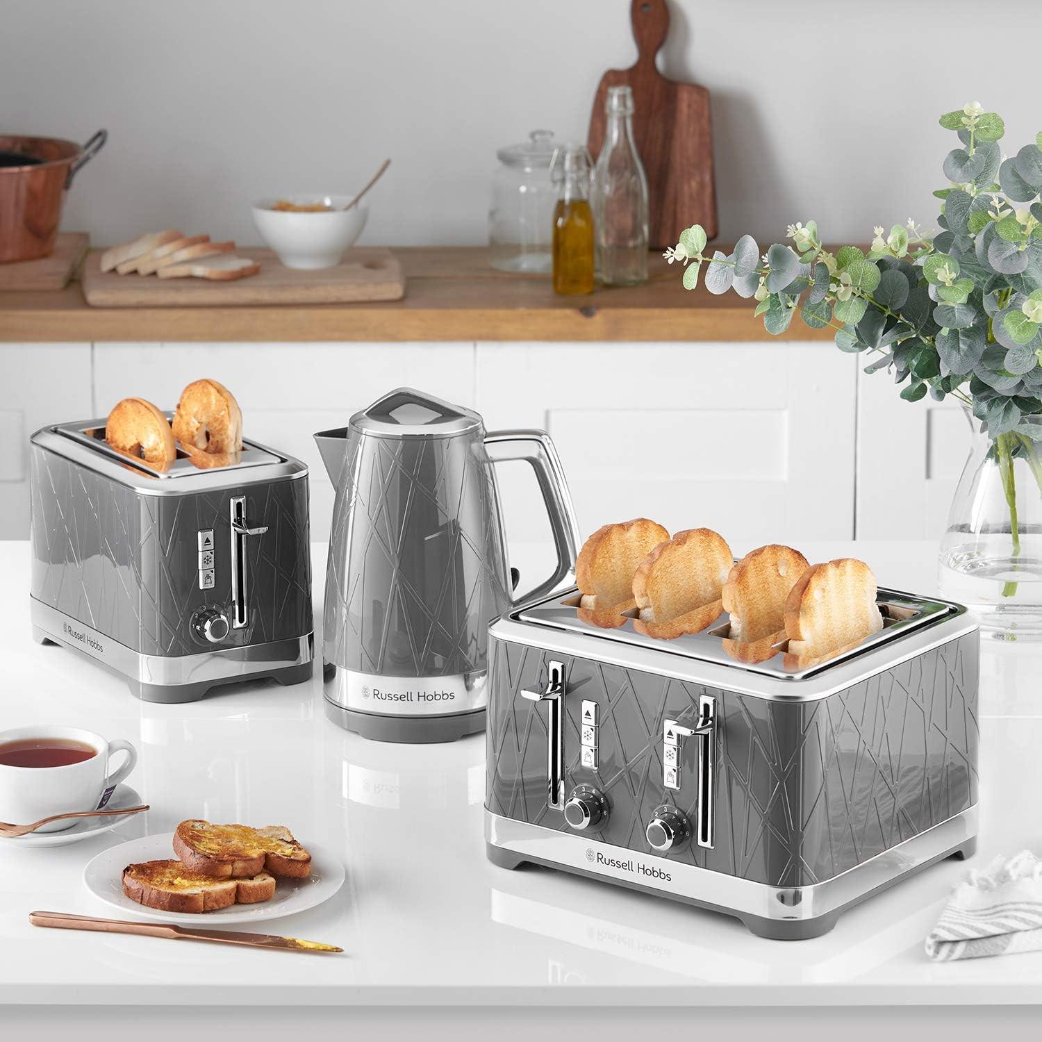 Grey 2-slice toaster with toast in open slots, chrome lever and front dial