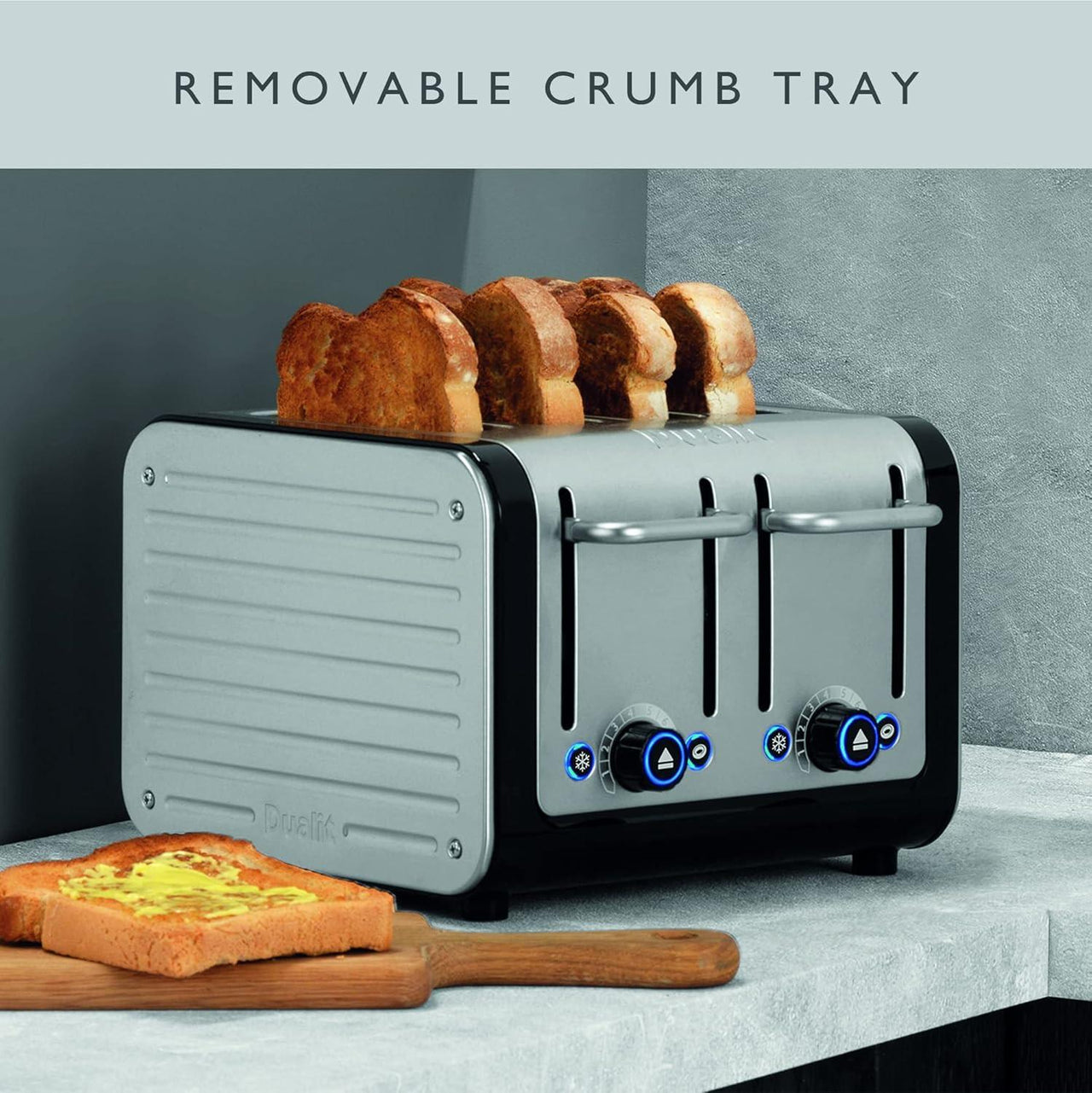 4-slice toaster with removable crumb tray extended and bread slices near the base