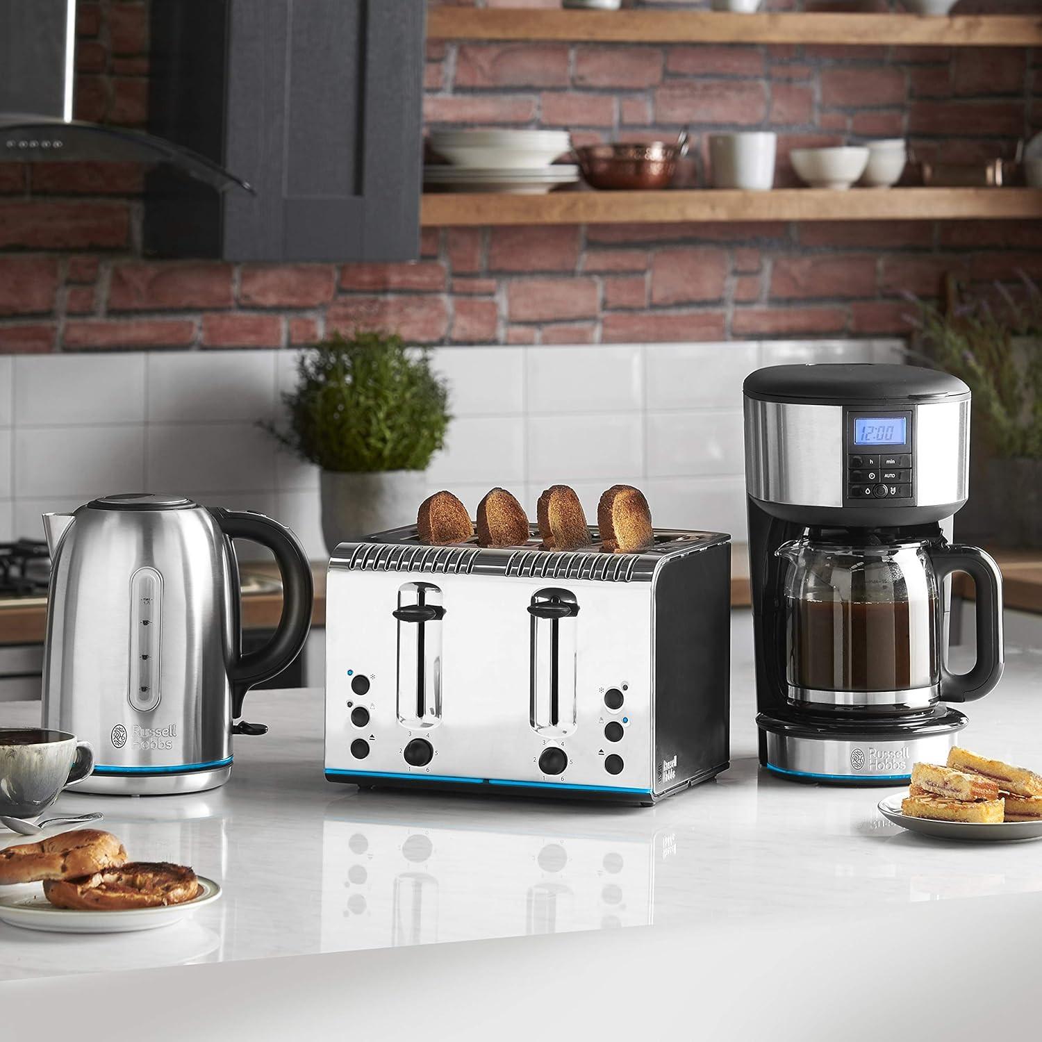 Stainless steel 4-slice toaster with four bread slices and blue base light strip
