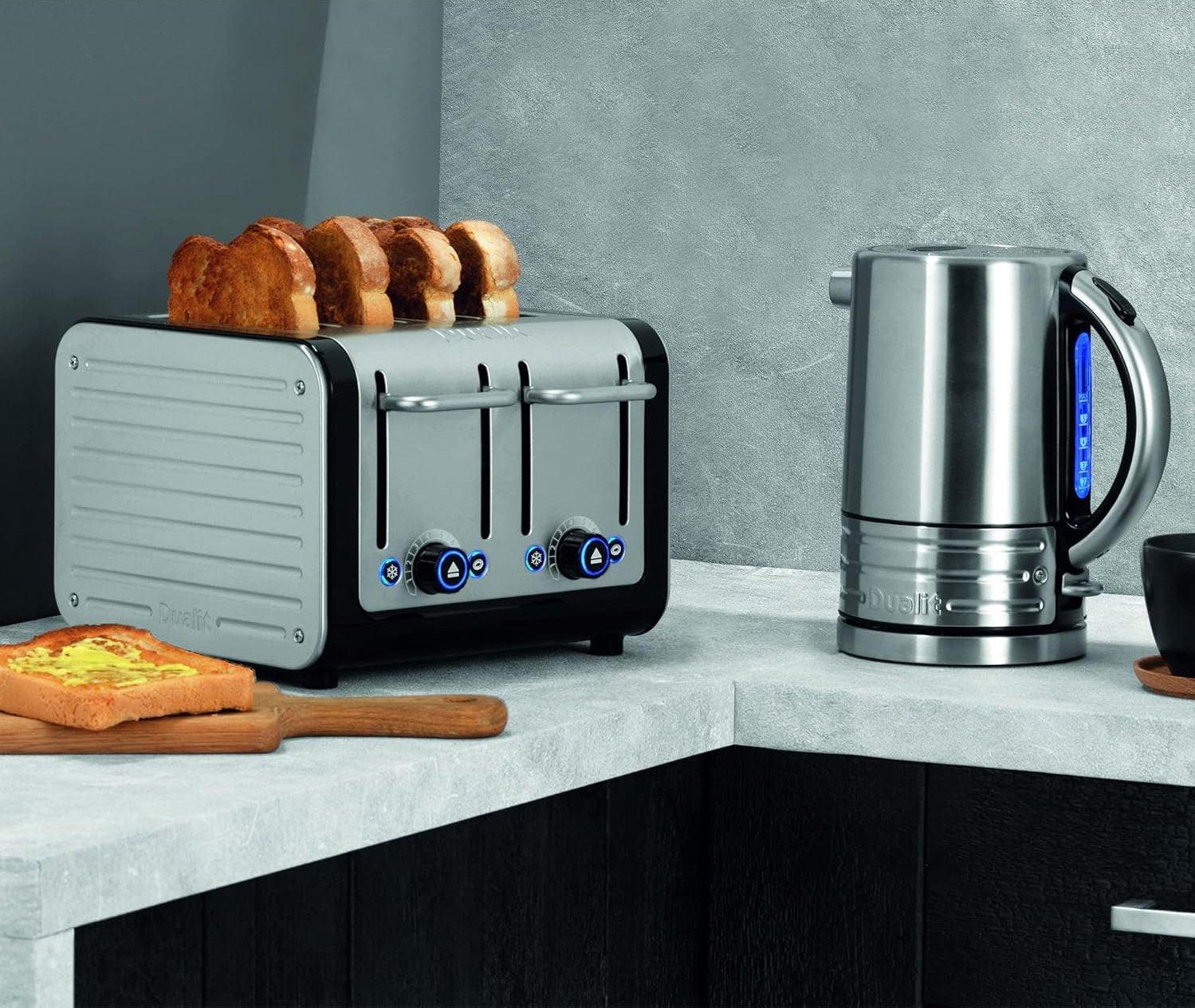 Stainless steel 4-slice toaster with black base; bread slices shown in raised slots