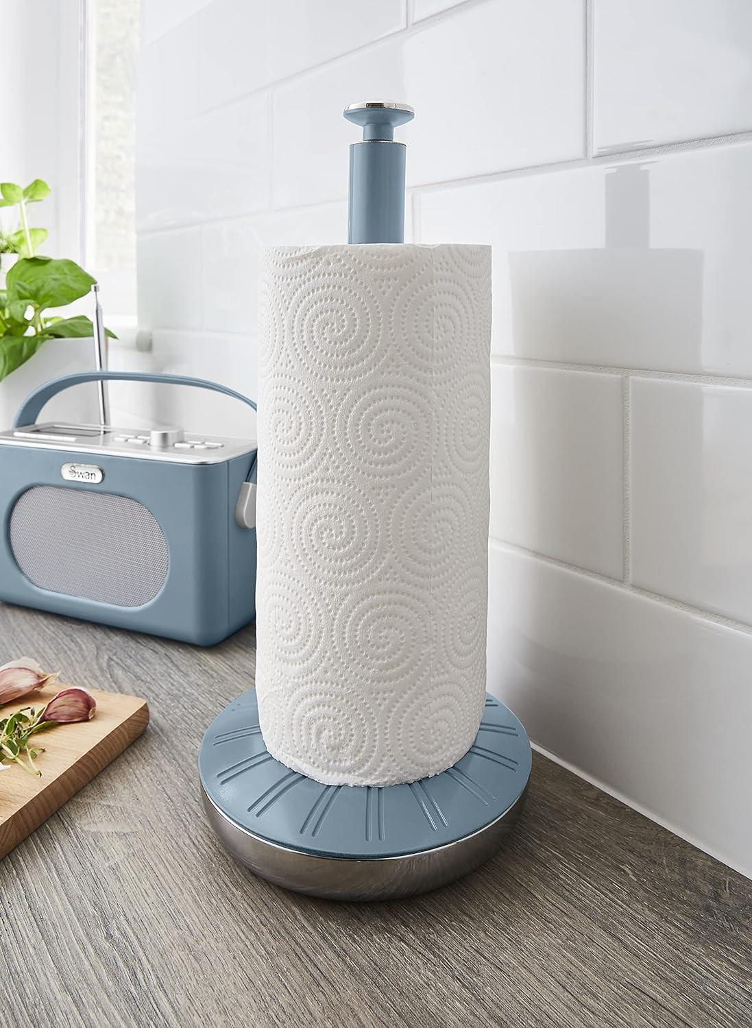 Blue countertop towel pole with round base holding a paper towel roll