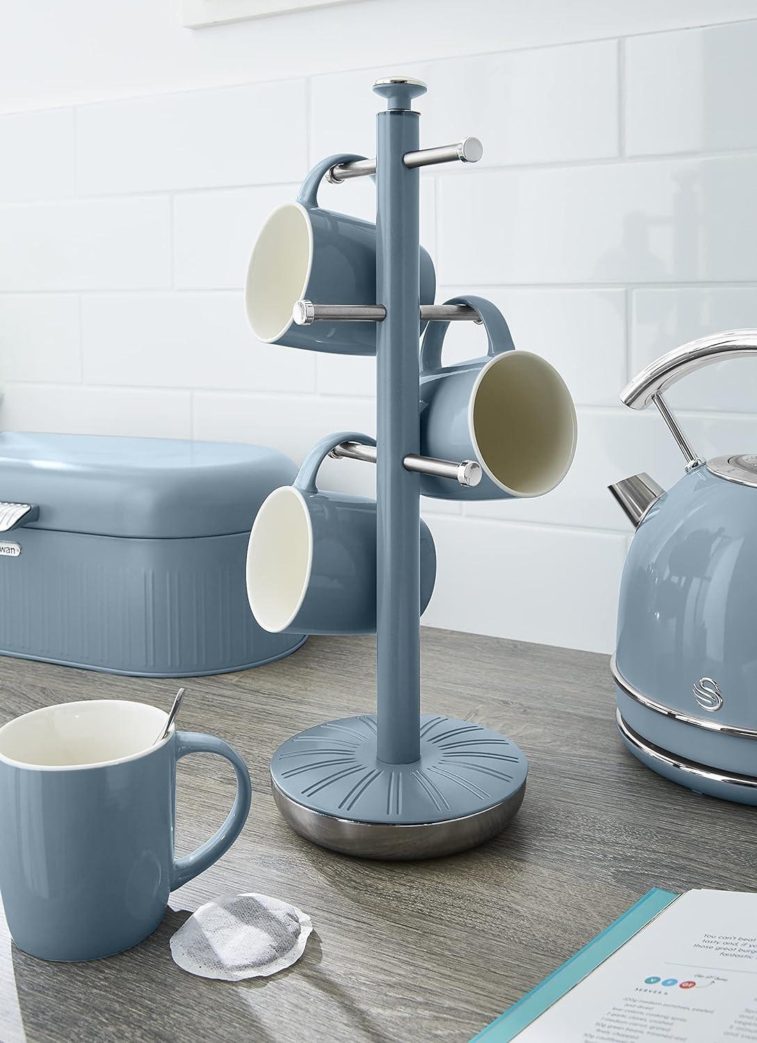 Blue mug tree towel pole with three mugs on arms and a towel roll