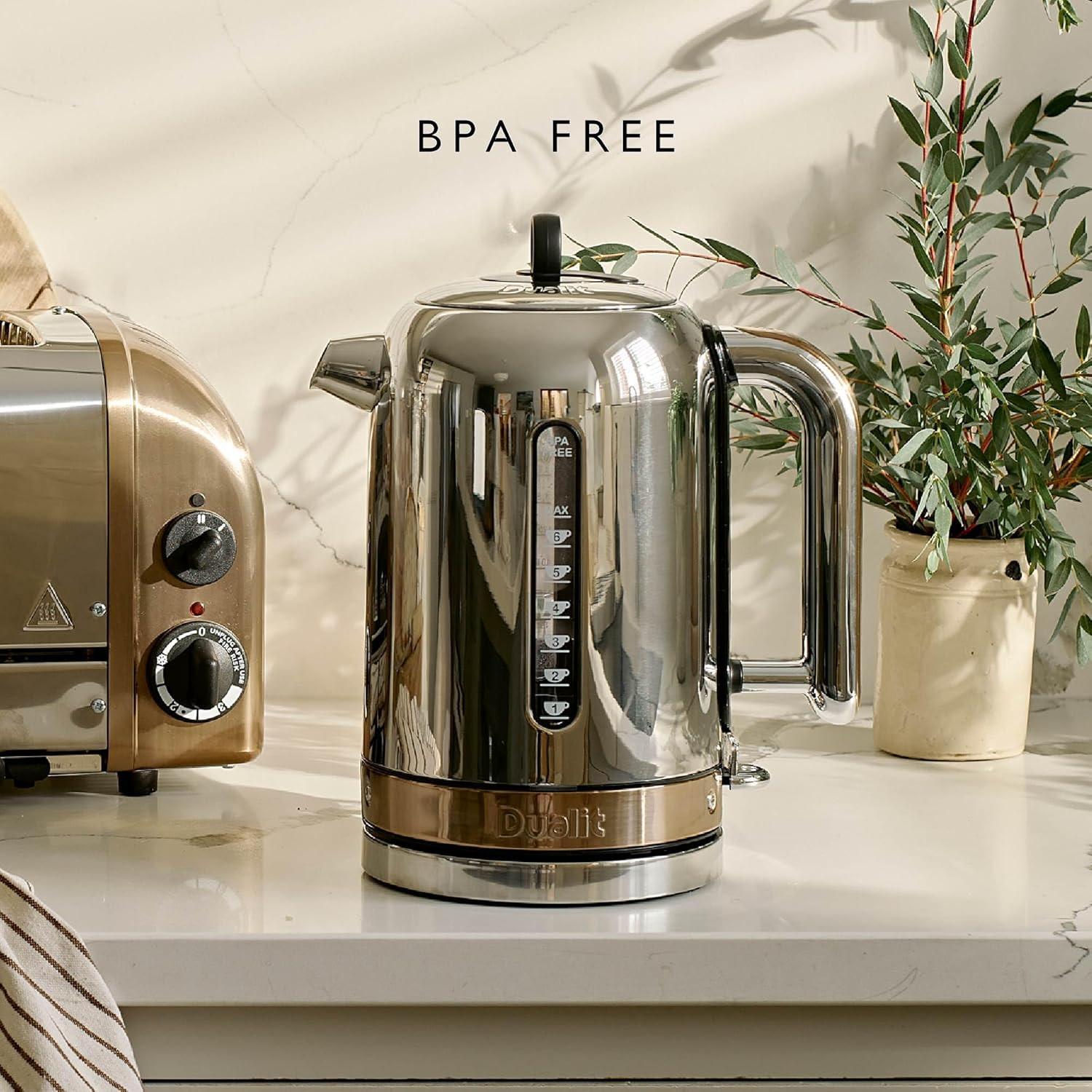 Dualit stainless steel jug kettle with copper trim and black control panel on countertop