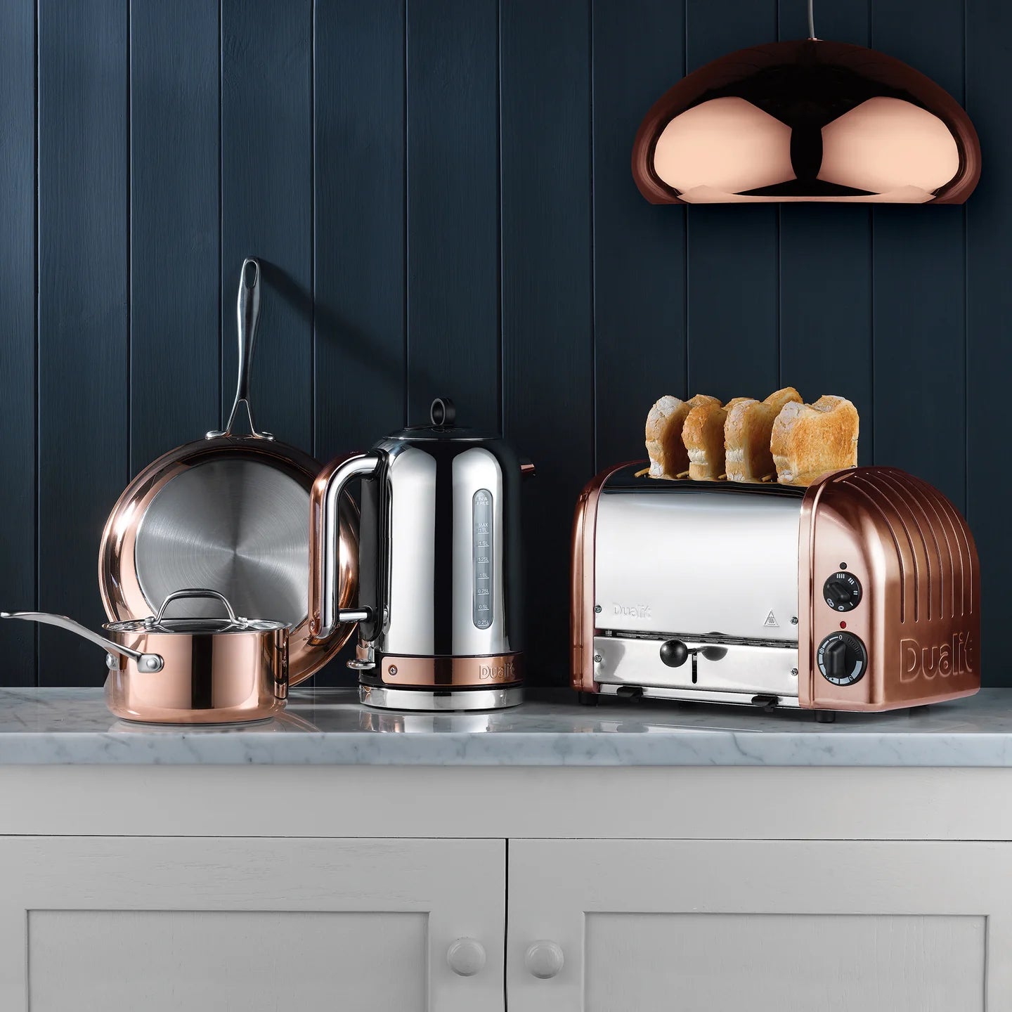 Copper Dualit kitchen set with kettle and 4-slice toaster on countertop