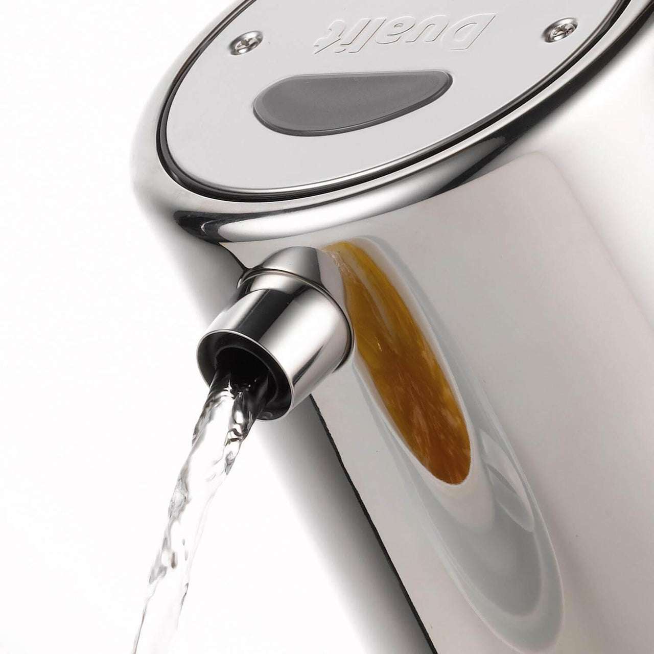 Stainless steel electric kettle with spout pouring a stream of water
