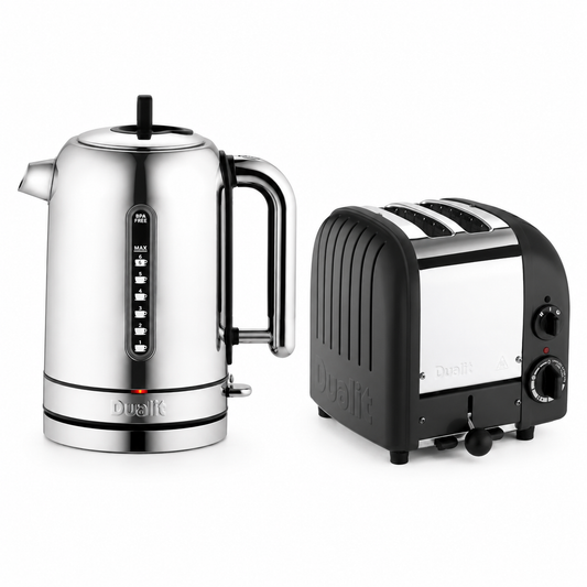 A Dualit stainless steel electric kettle and a Dualit black and silver two-slice toaster, shown side-by-side on a clean white background.