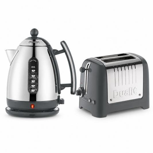 A Dualit electric kettle and a Dualit four-slot toaster in matching black and stainless steel, shown on a clean white background.
