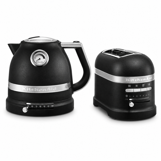A KitchenAid electric kettle and a matching two-slice toaster in matte black with silver accents, shown on a clean white background.