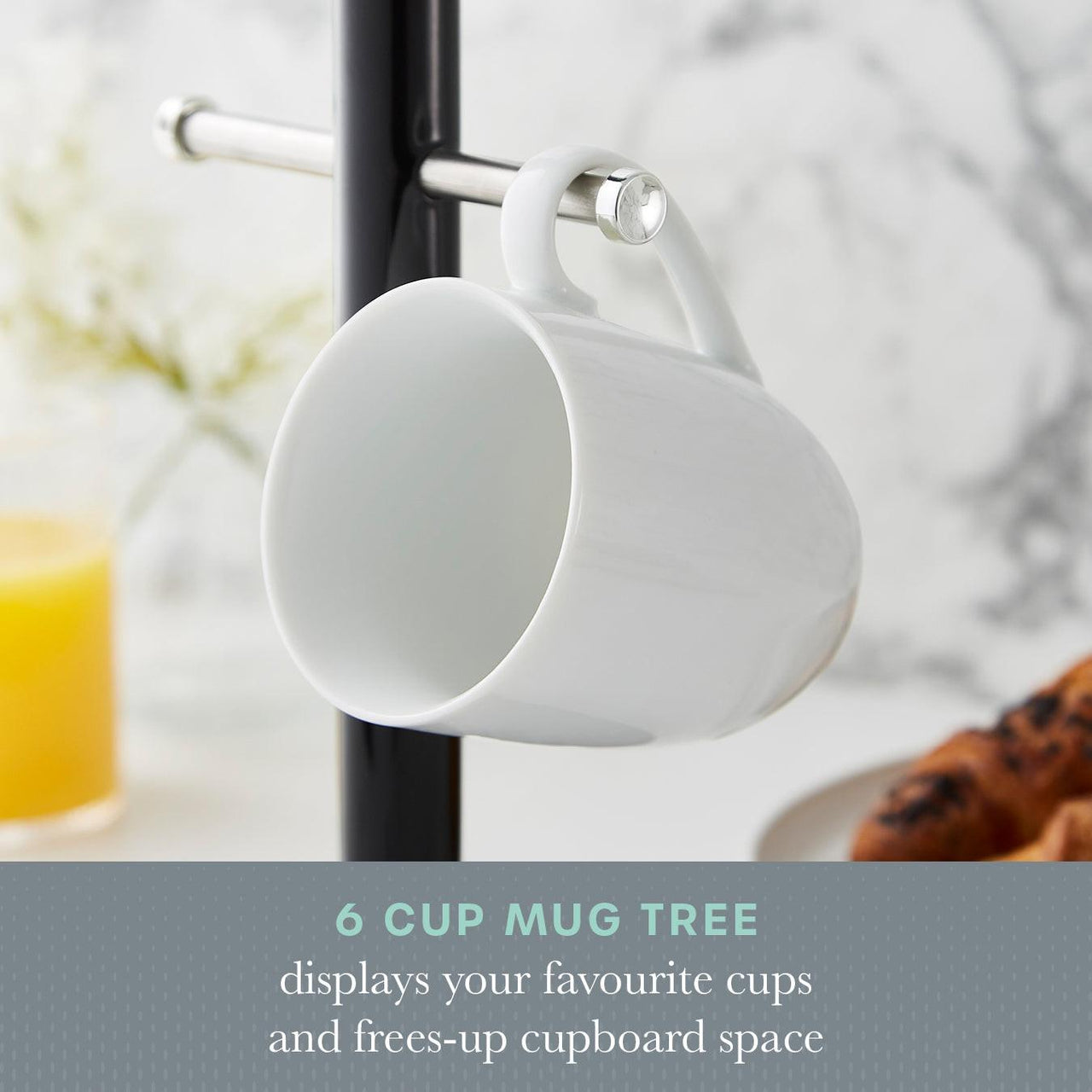 Black pole mug tree with white cups on side hooks