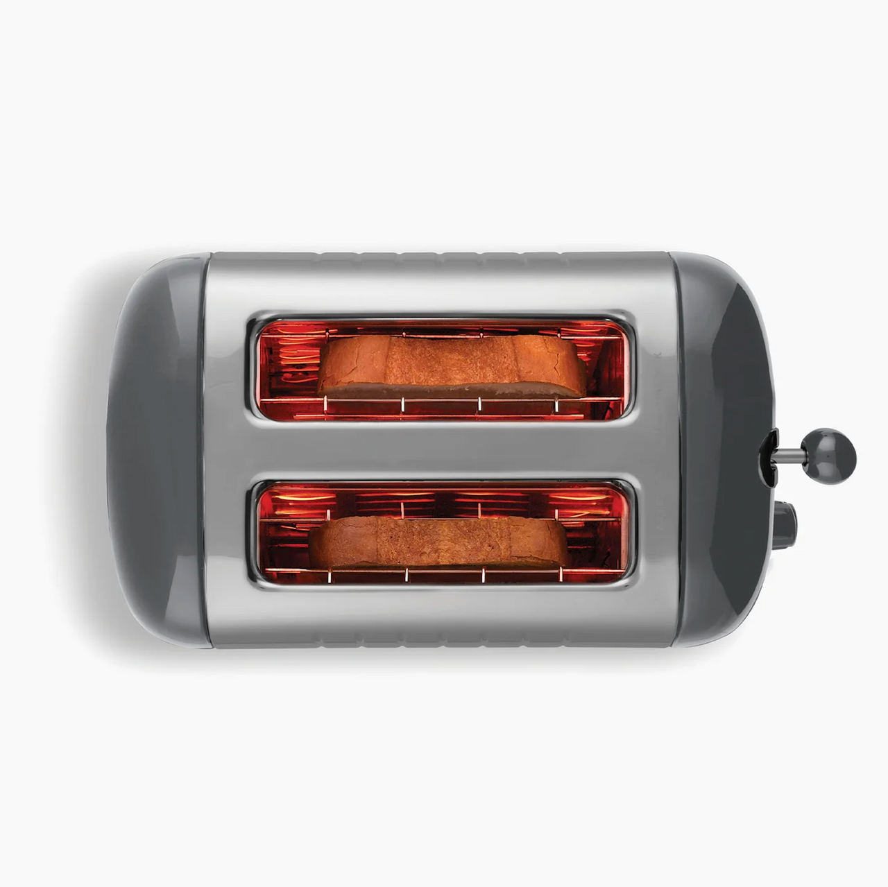 Grey 2-slice toaster with both slots glowing red during toasting