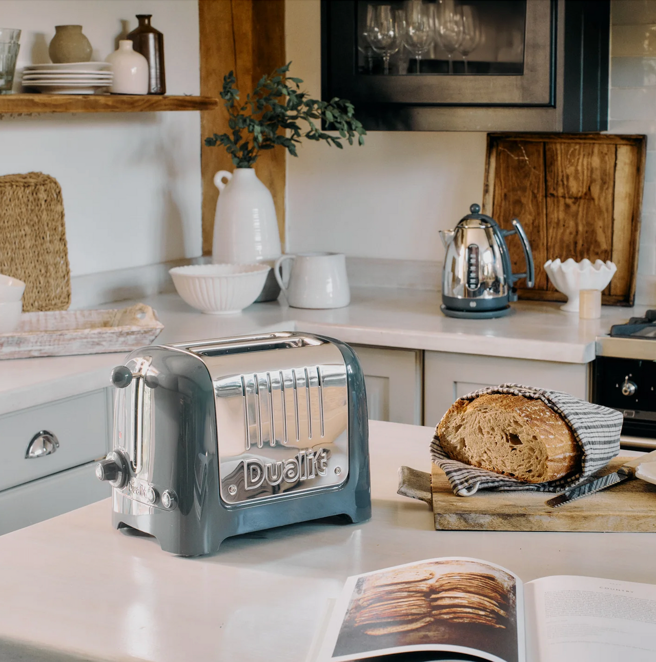 Grey Dualit 2-slice toaster on kitchen counter with chrome accents and lever