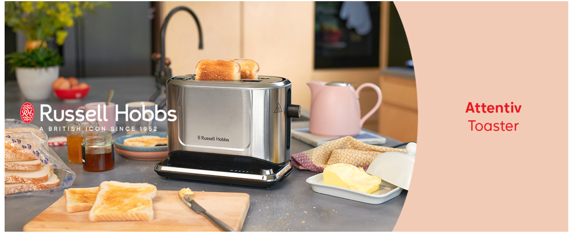 Stainless steel 2-slice toaster on countertop with toast popping up