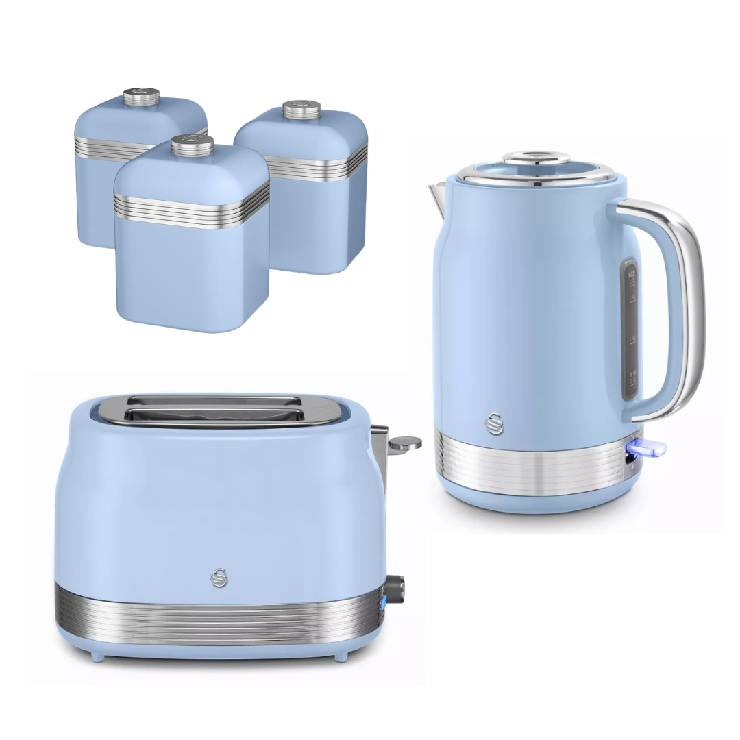 A matching kitchen appliance set in a light pastel blue color with silver metallic accents, including a two-slot toaster, an electric kettle, and three canisters, arranged on a plain white background.