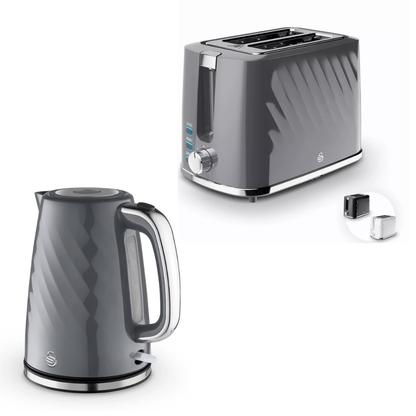 A dark gray electric kettle and a matching four-slot toaster with a small inset showing a replacement filter, both on a clean white background.