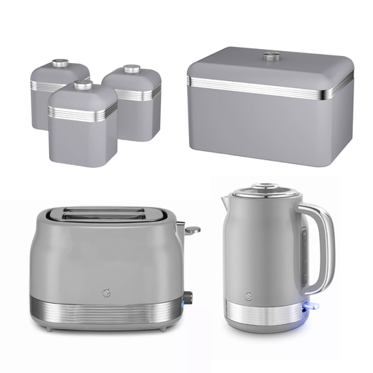 A coordinated kitchen appliance set in a brushed silver-gray finish with stainless steel accents, including a toaster, electric kettle, three canisters, and a rectangular storage box, shown on a plain white background.